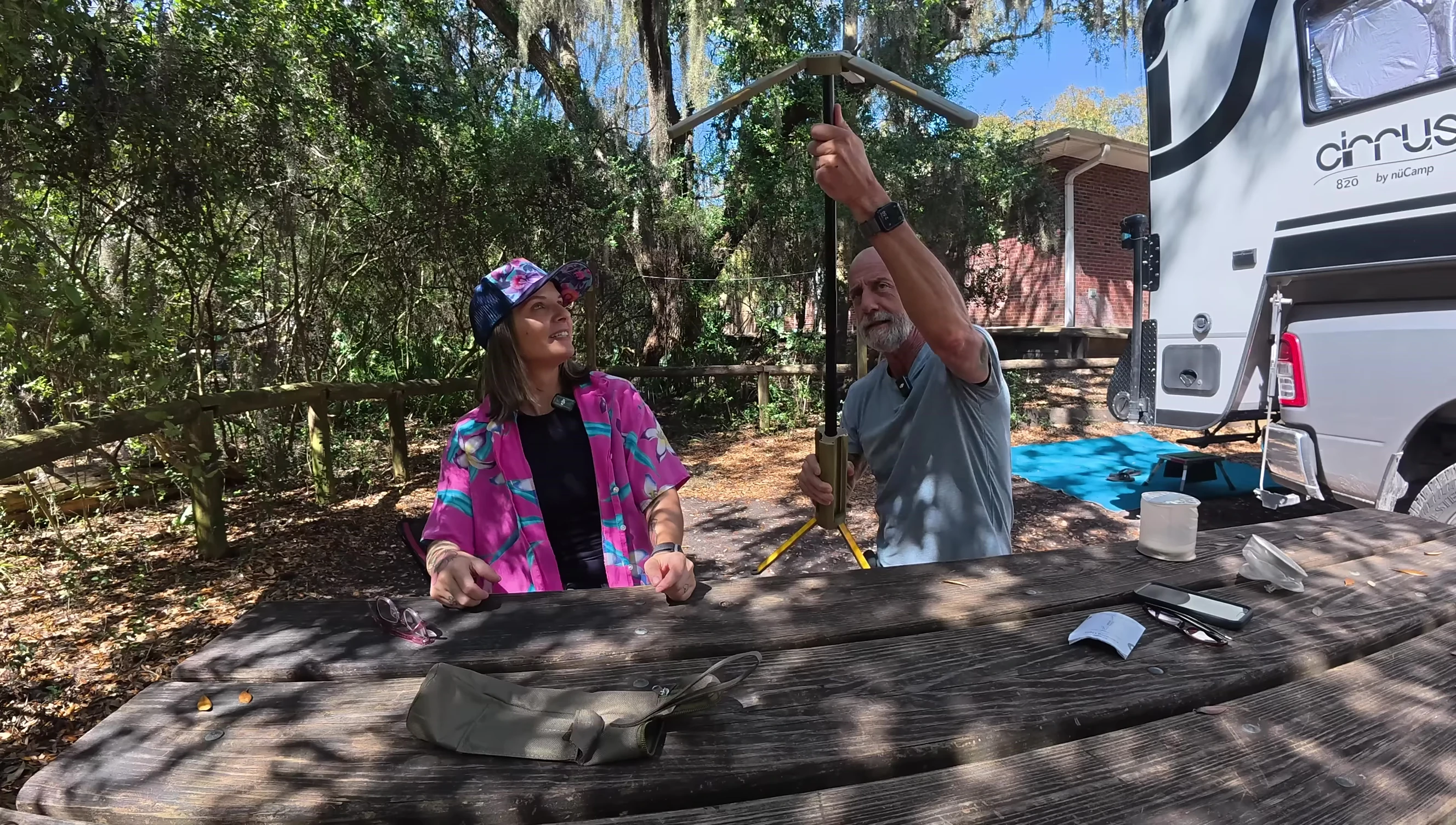 The reviewer demonstrates the height adjustability.