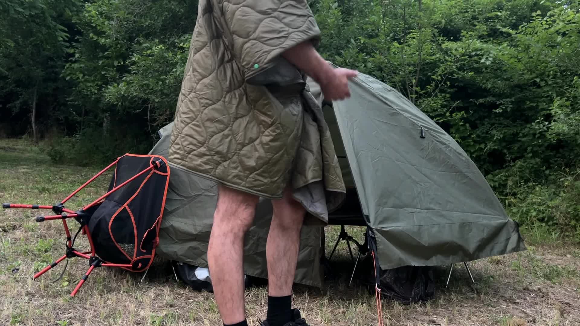 The speaker emerging from the tent