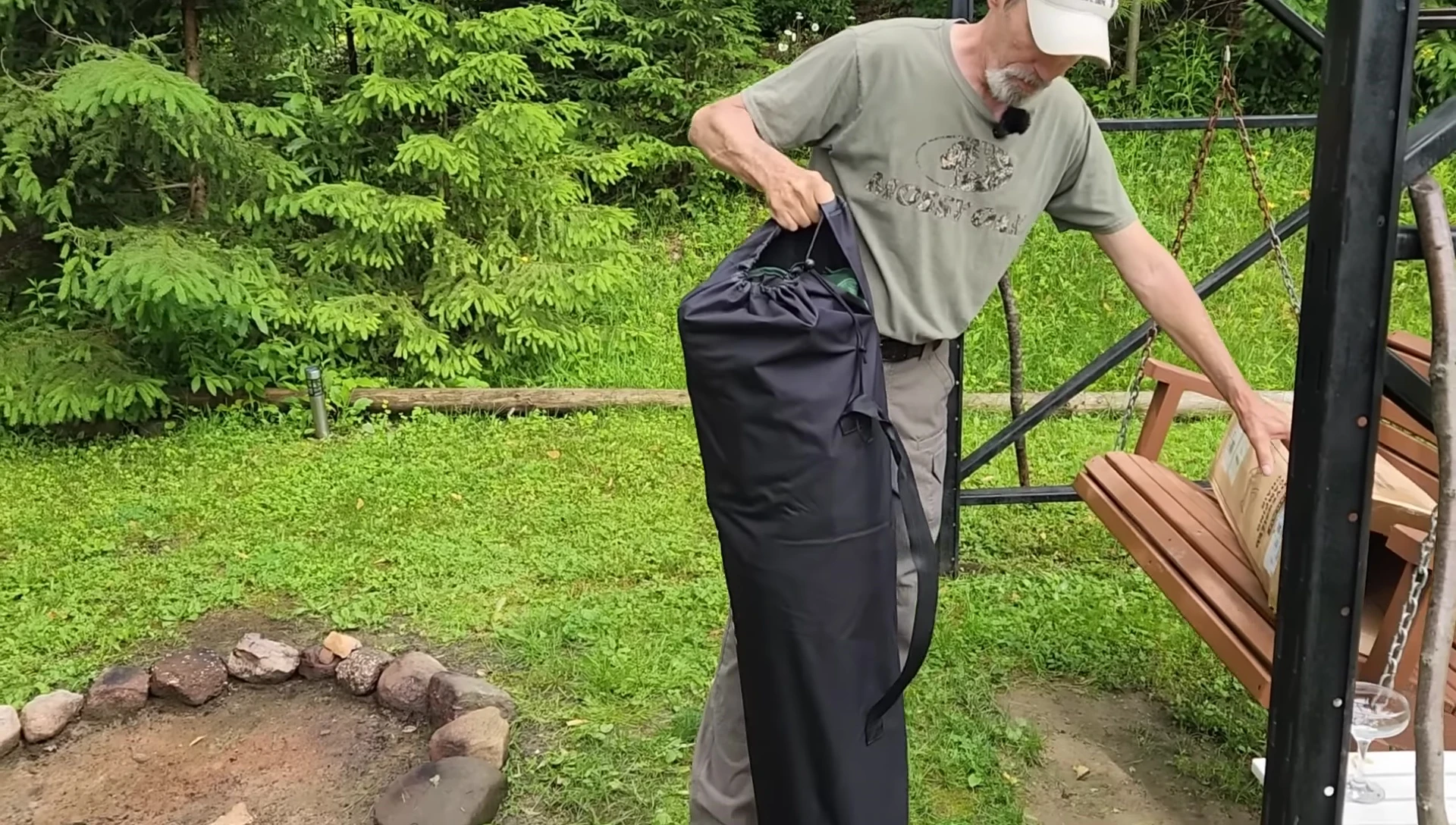 The carrying sack with straps and drawstring closure.