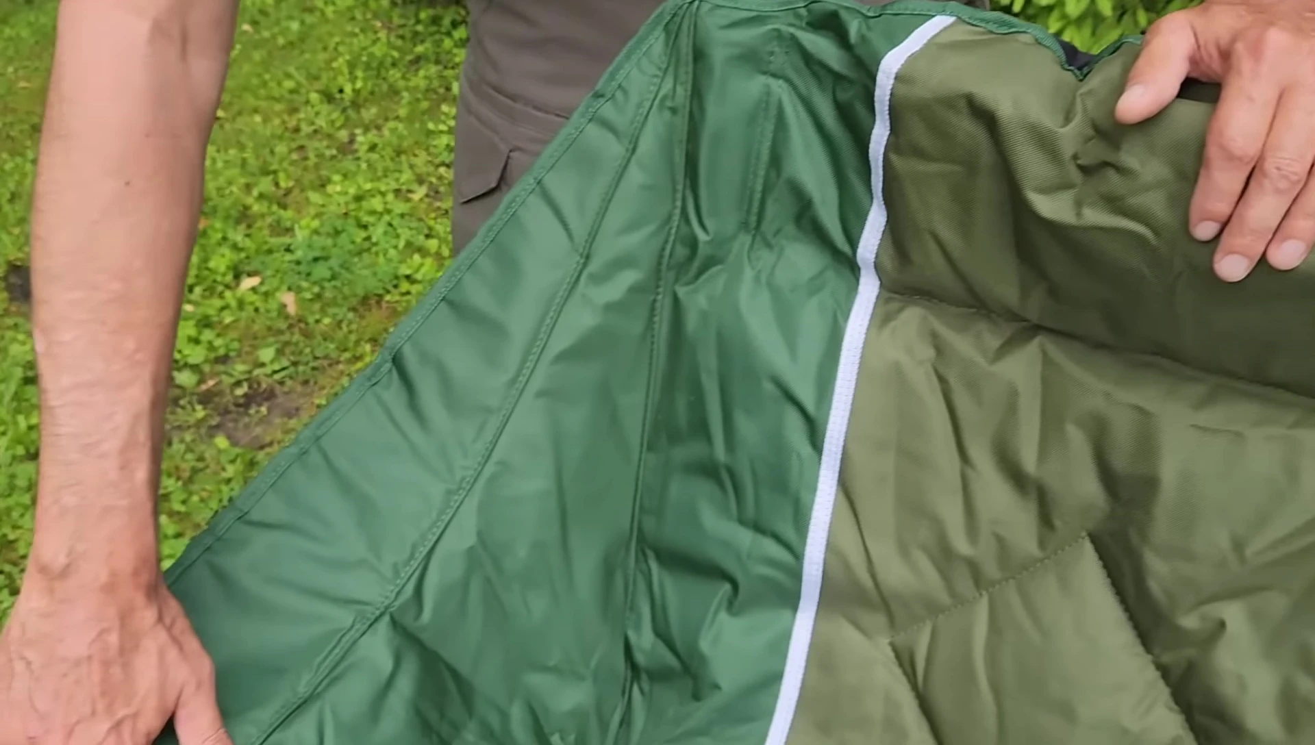 Close-up view of the oversized drink holders and storage compartment.