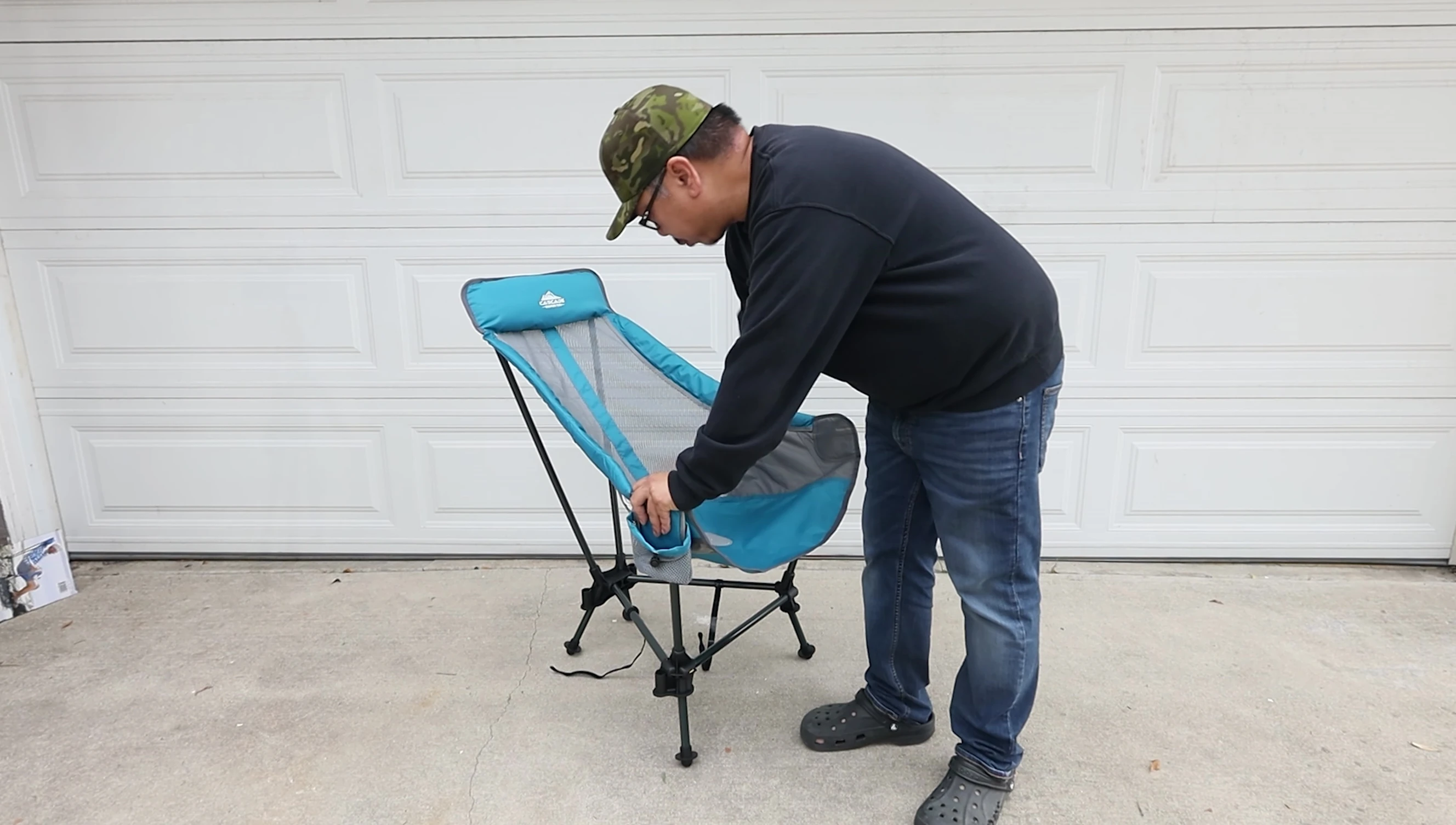 Close-up of the chair's breathable mesh seat and drink holder.