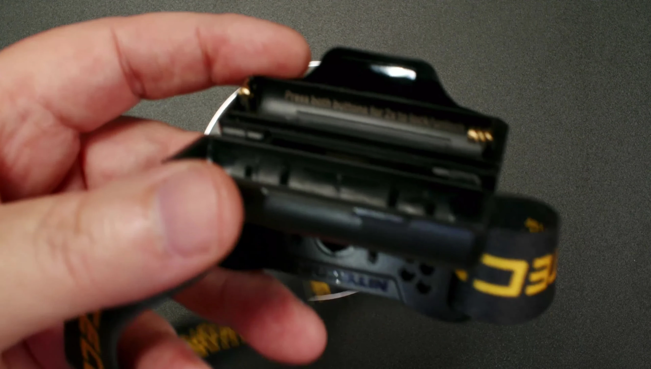 Close-up of battery compartment engravings