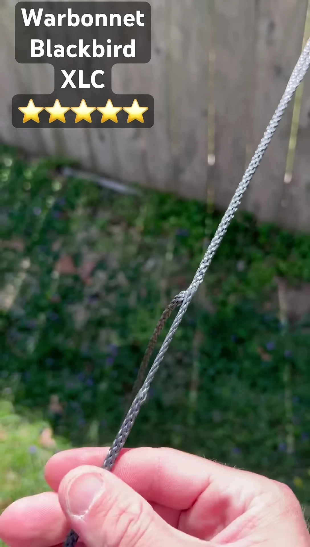 Demonstrating the one-handed adjustment of the hammock height using the whoopie slings.