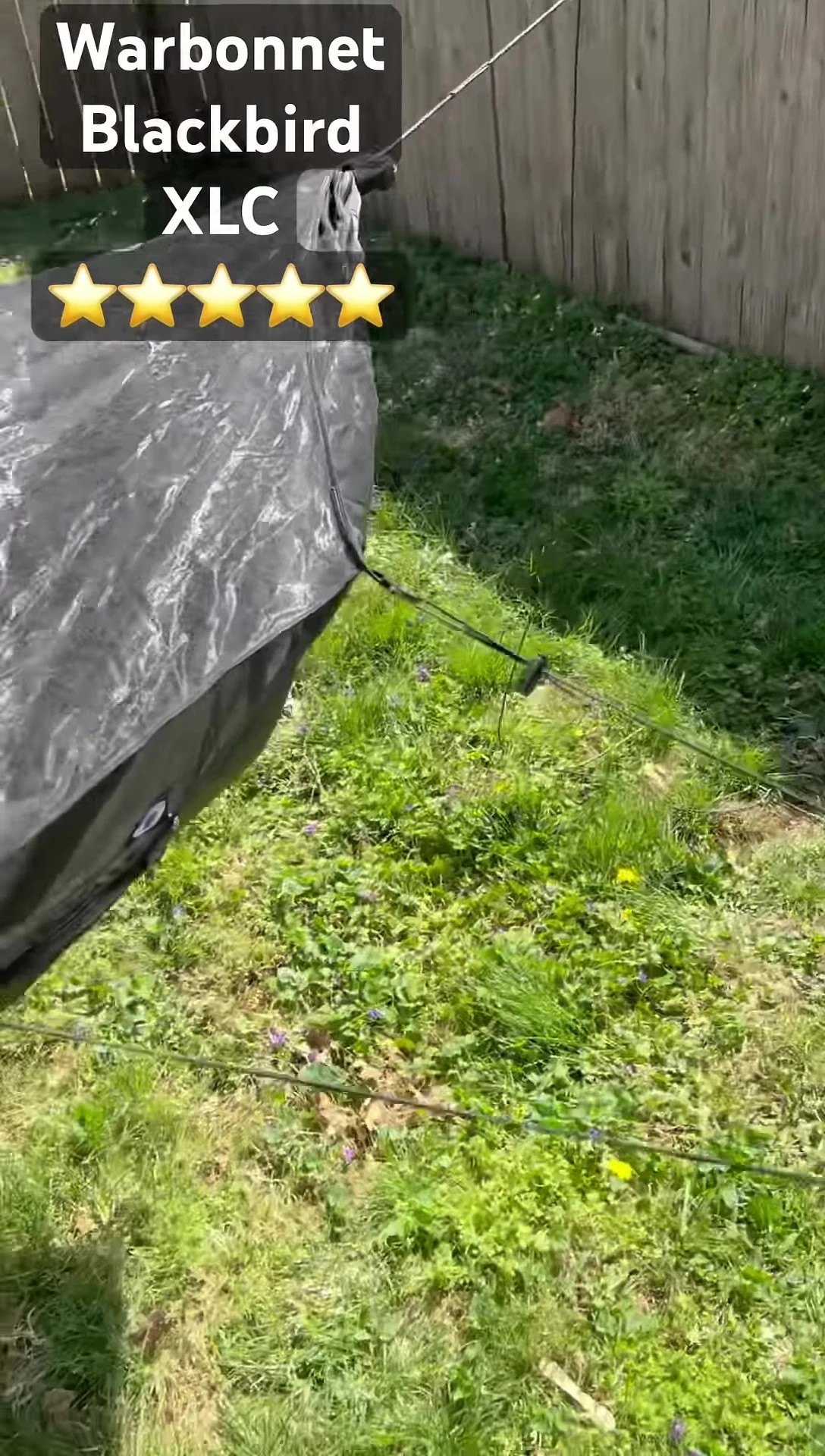 The reviewer showcasing the elastic band securing the bug net.