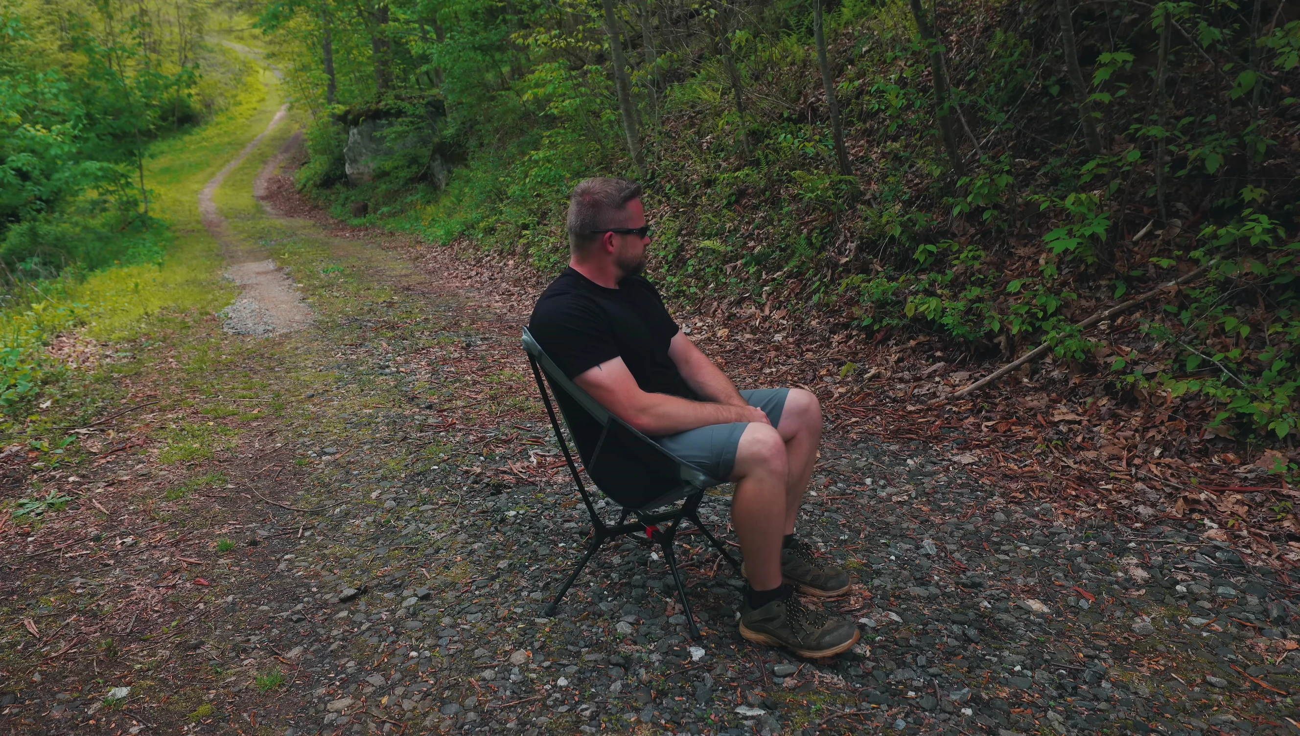 The reviewer sitting comfortably in the Naturehike LY01 chair