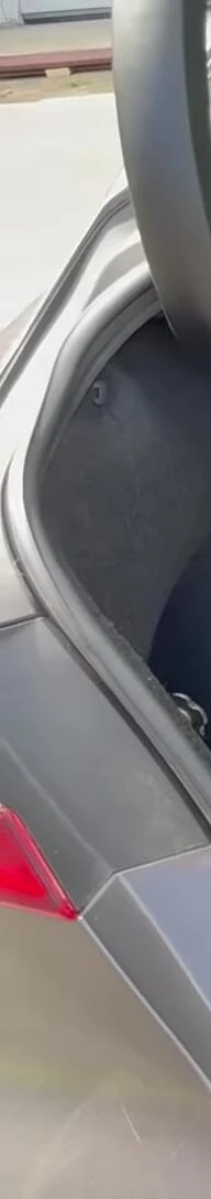 The chair in the trunk of a car.