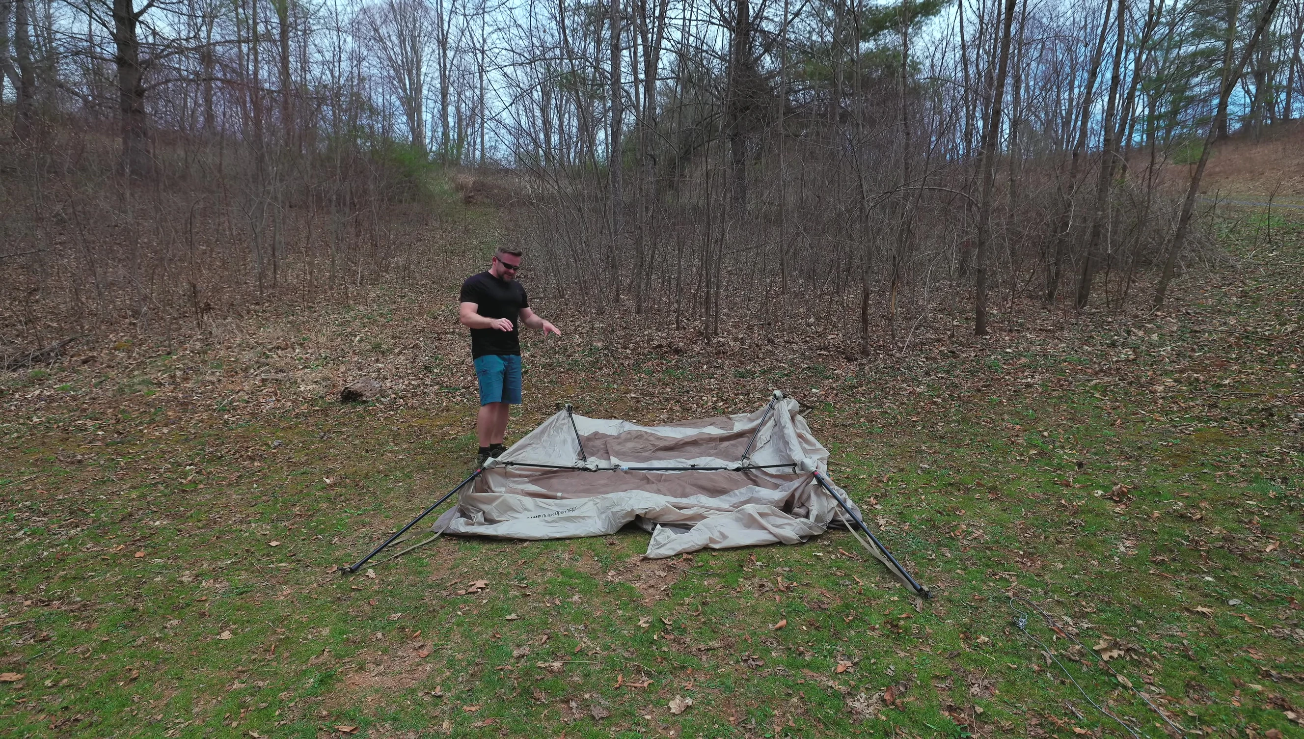 Person raising the tent frame