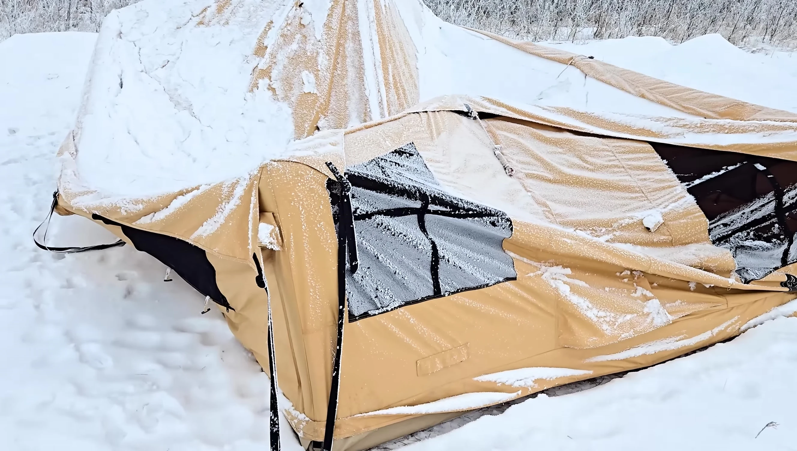 The deflated tent under snow