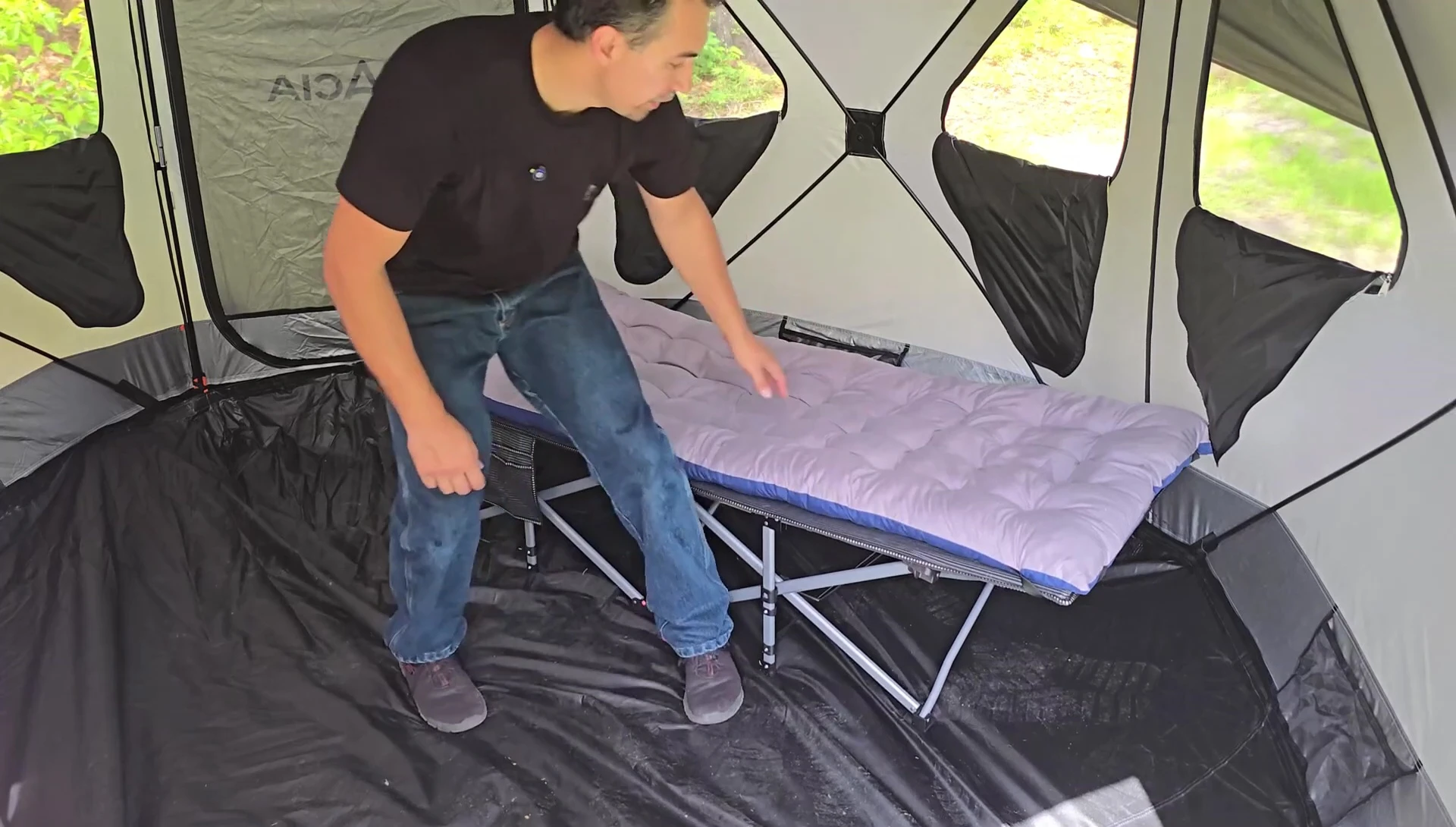 Close-up shot highlighting the cot's length and width.