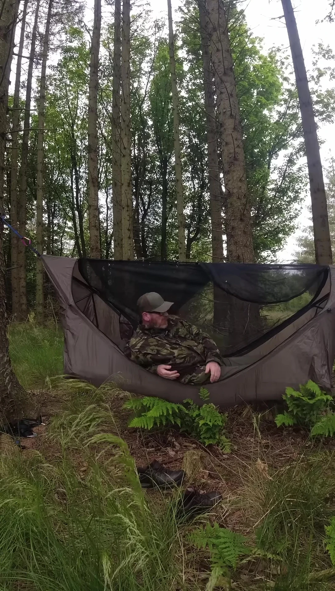 The reviewer comfortably settled in the hammock.