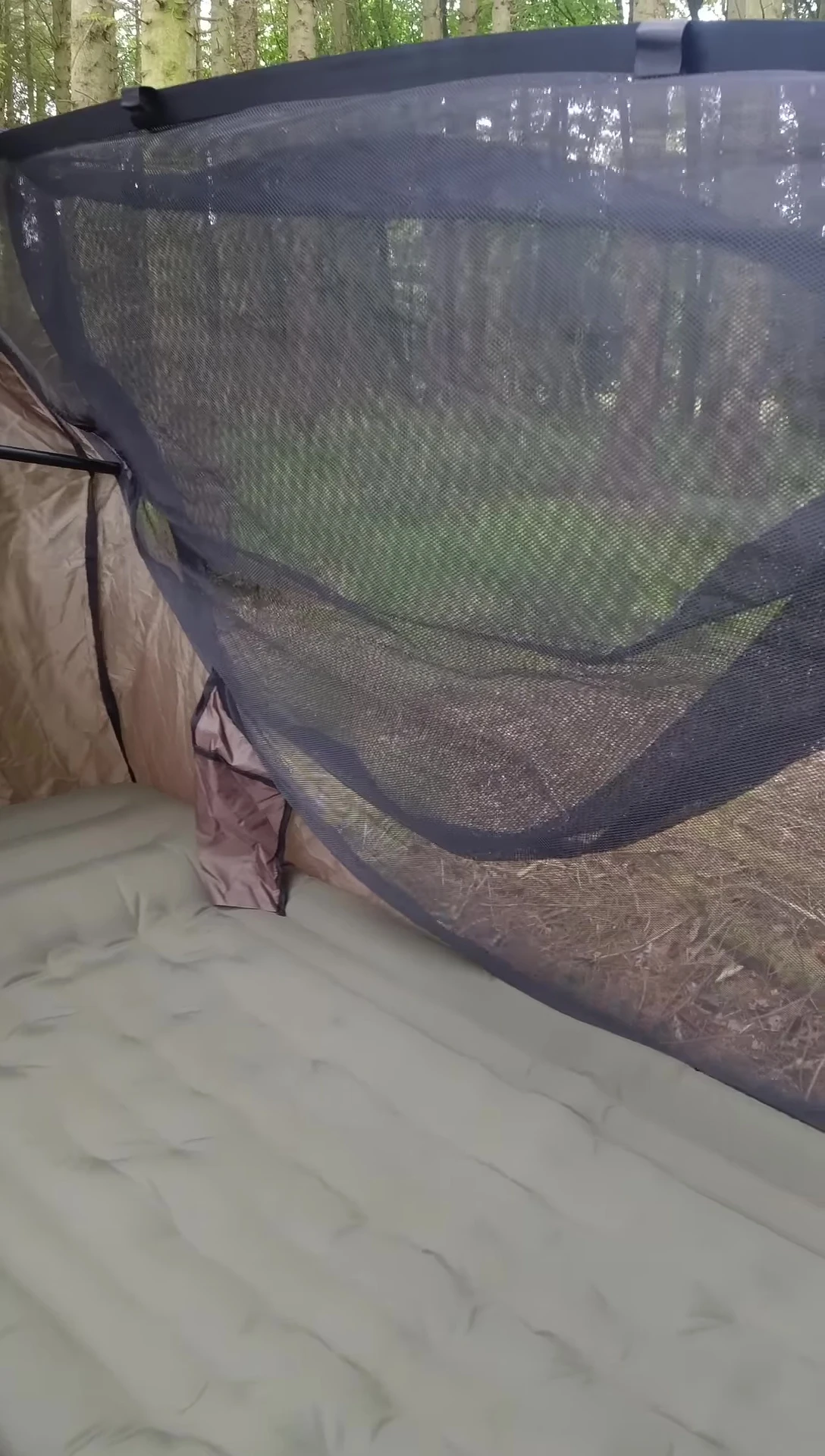 The reviewer getting into the hammock.