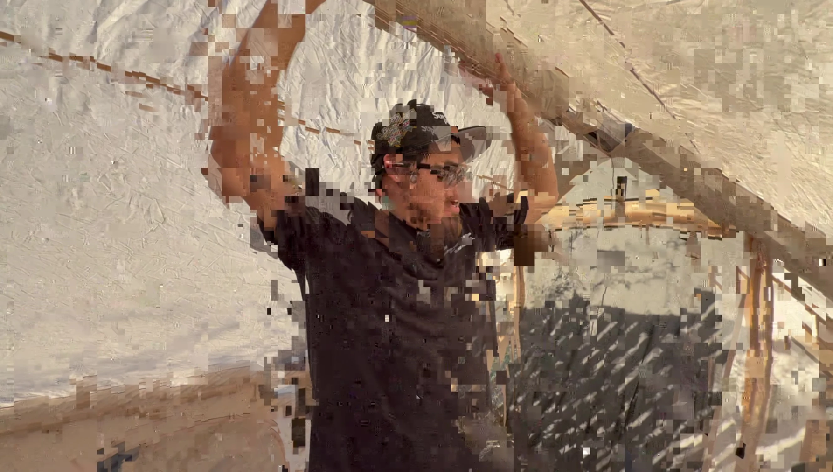 The reviewer standing inside the tent, showing the available space.