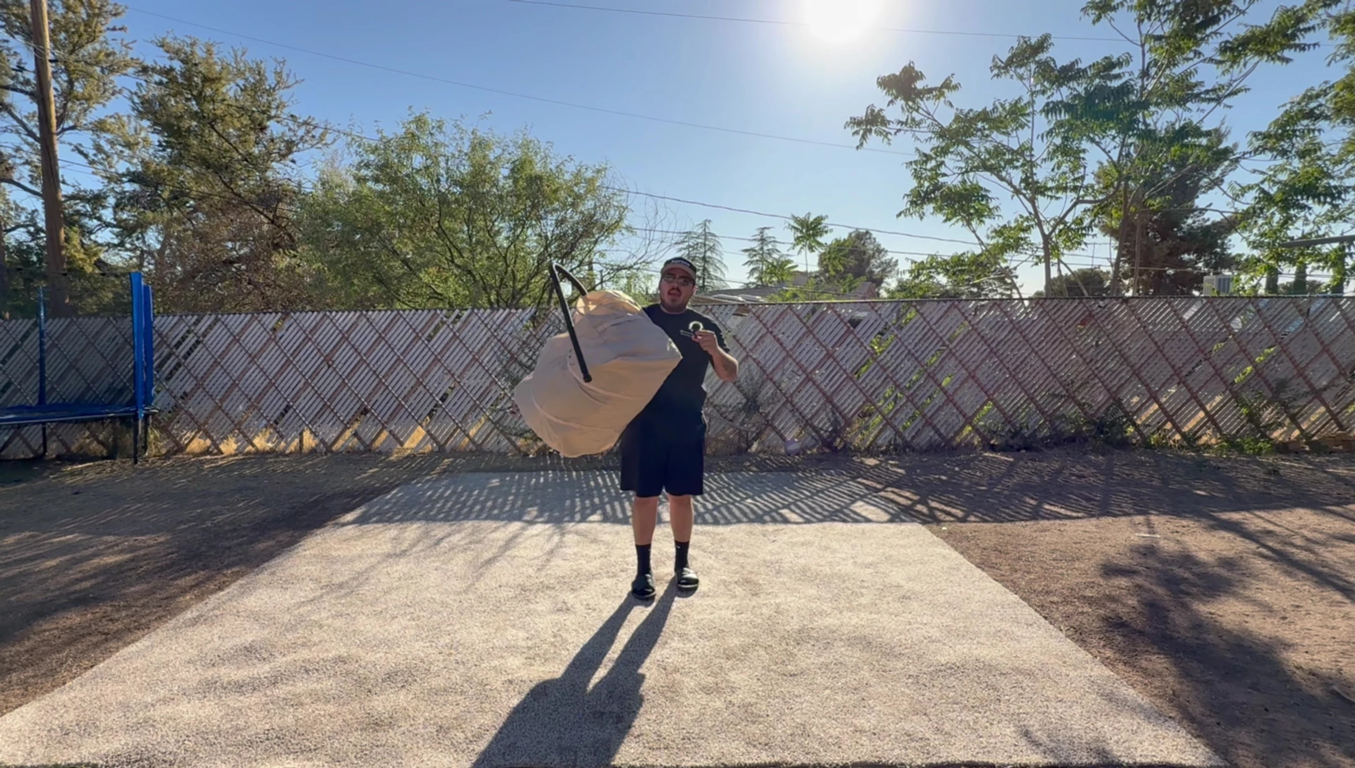 The large bag containing the inflatable tent.