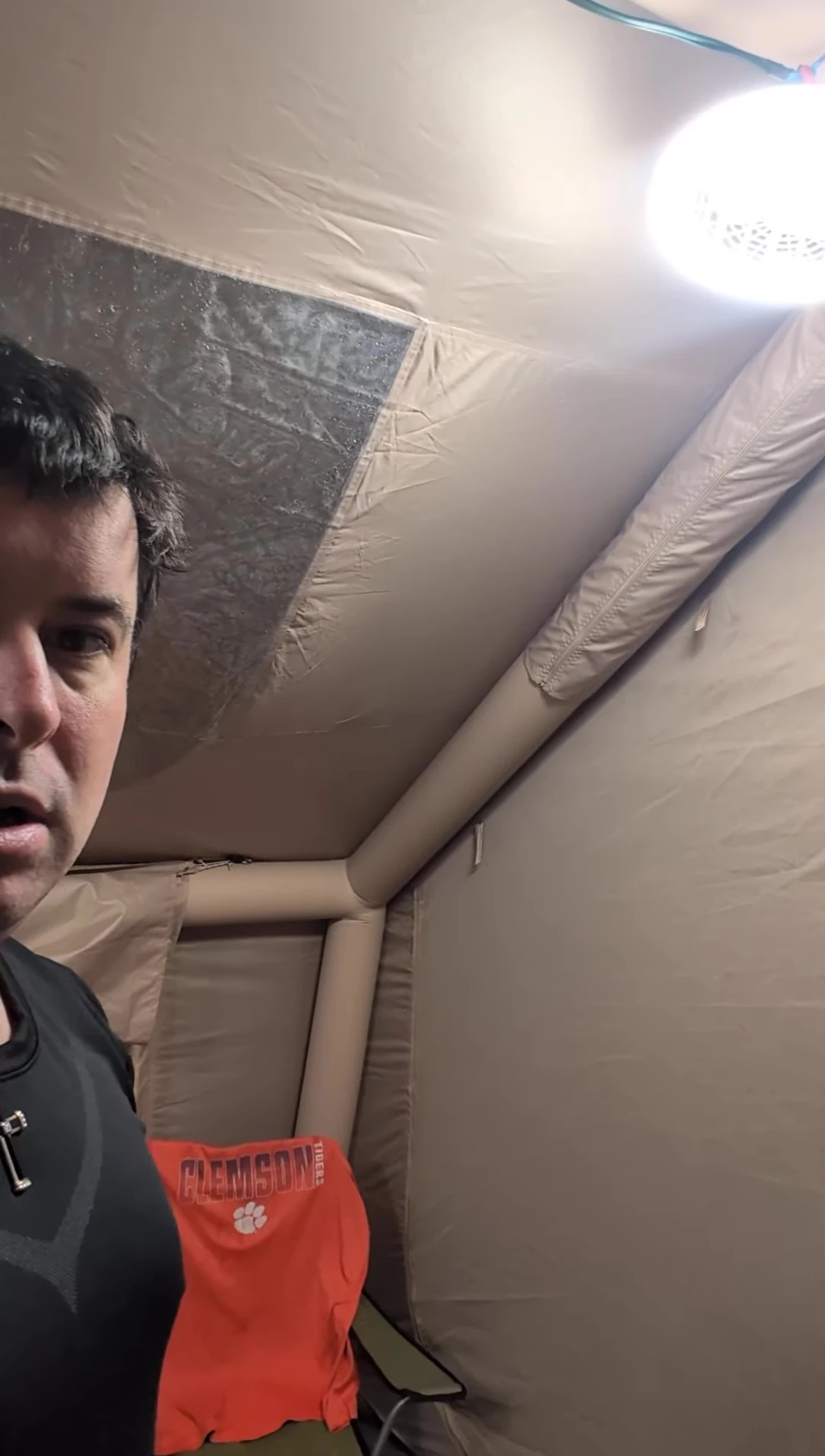 The tent walls slightly moving while the poles remain stable.