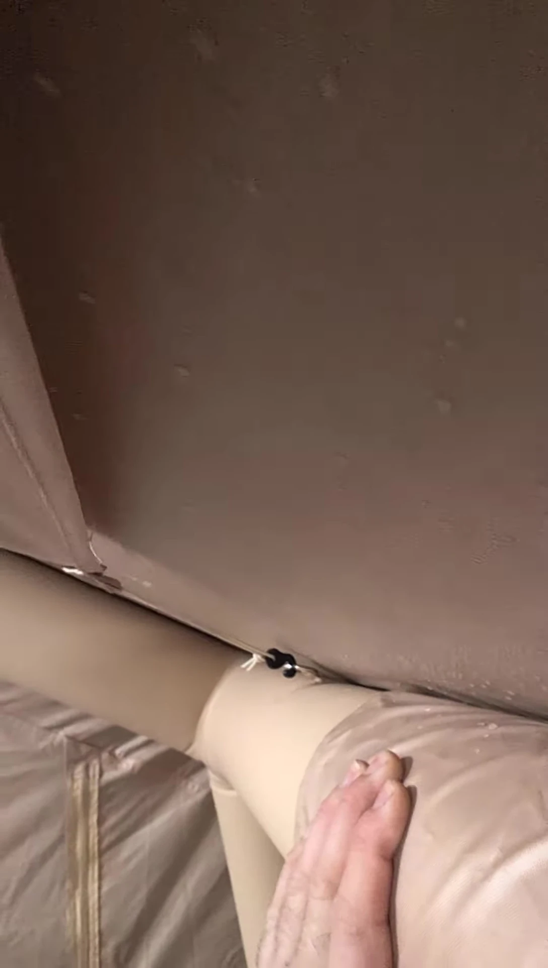 The dry tent floor despite some water droplets on the walls.
