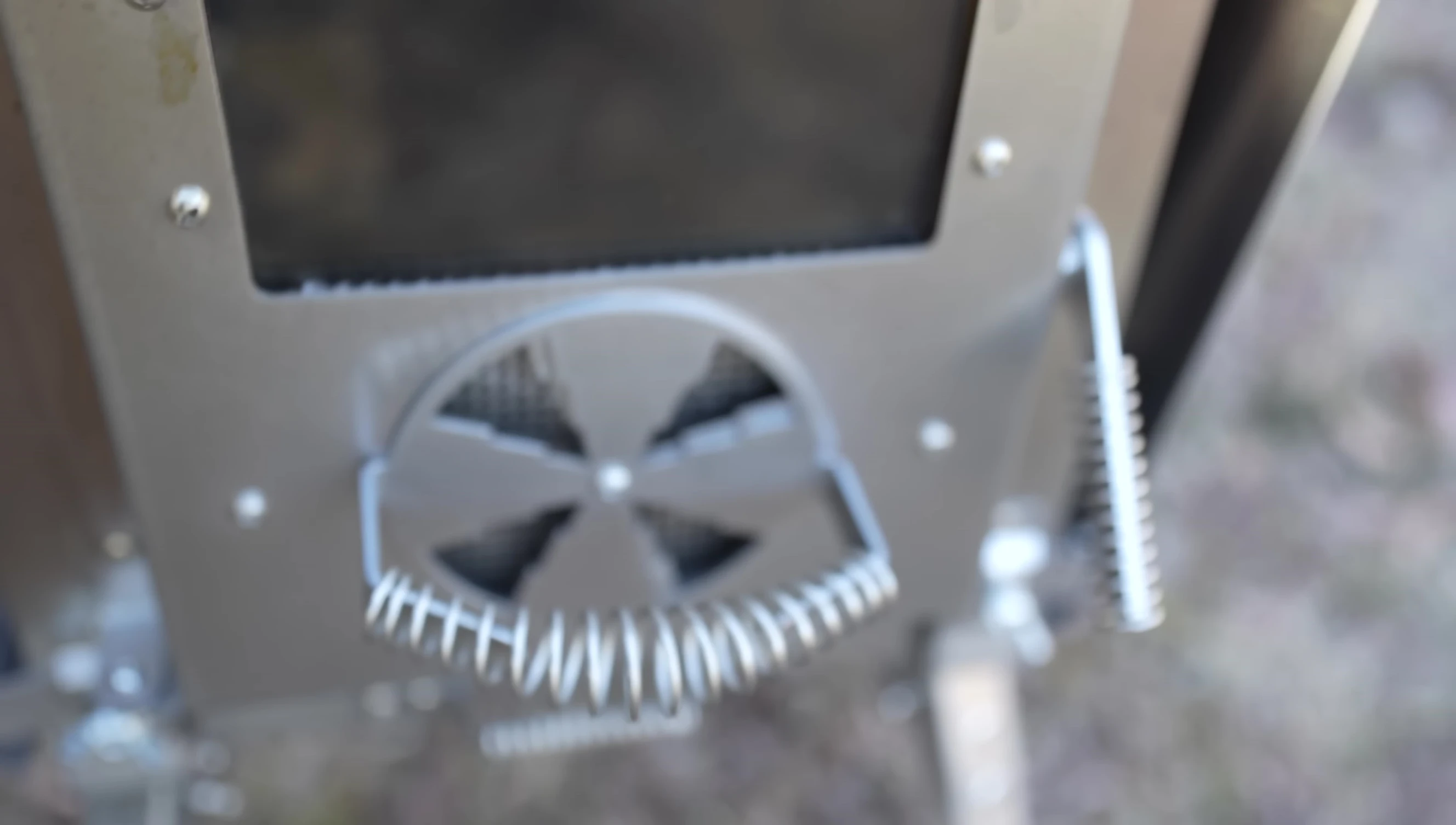 Close-up of the stove's features, including the glass door and venting system.