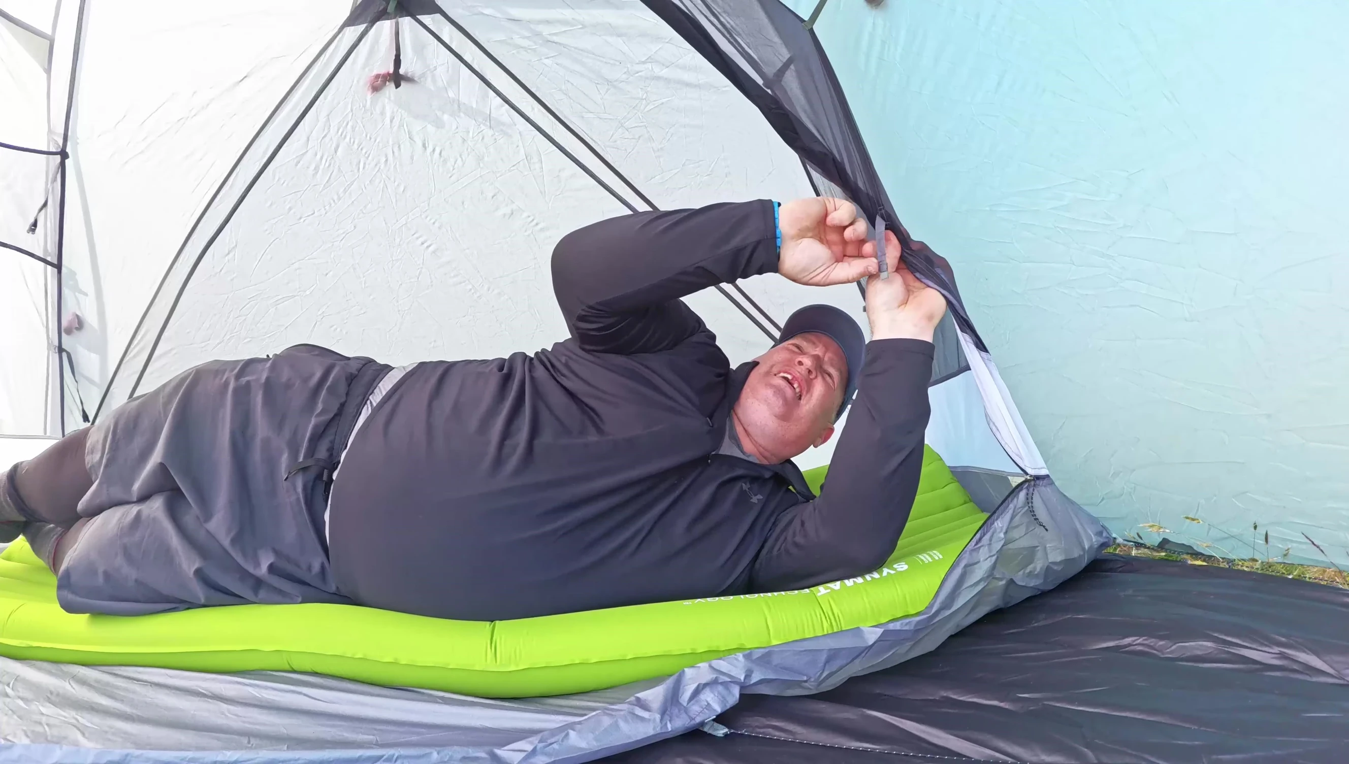 The reviewer lying comfortably on the Exped Ultra 3R LW sleeping pad.