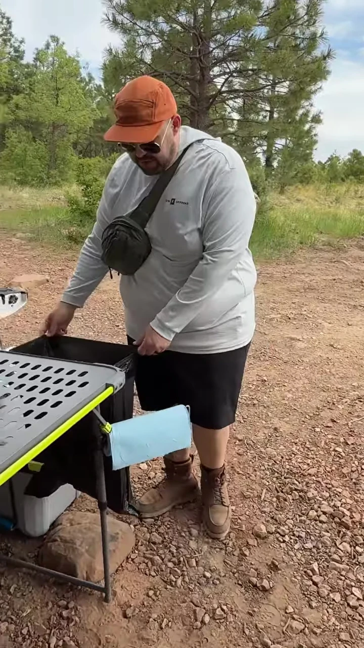 The integrated trash bag holder