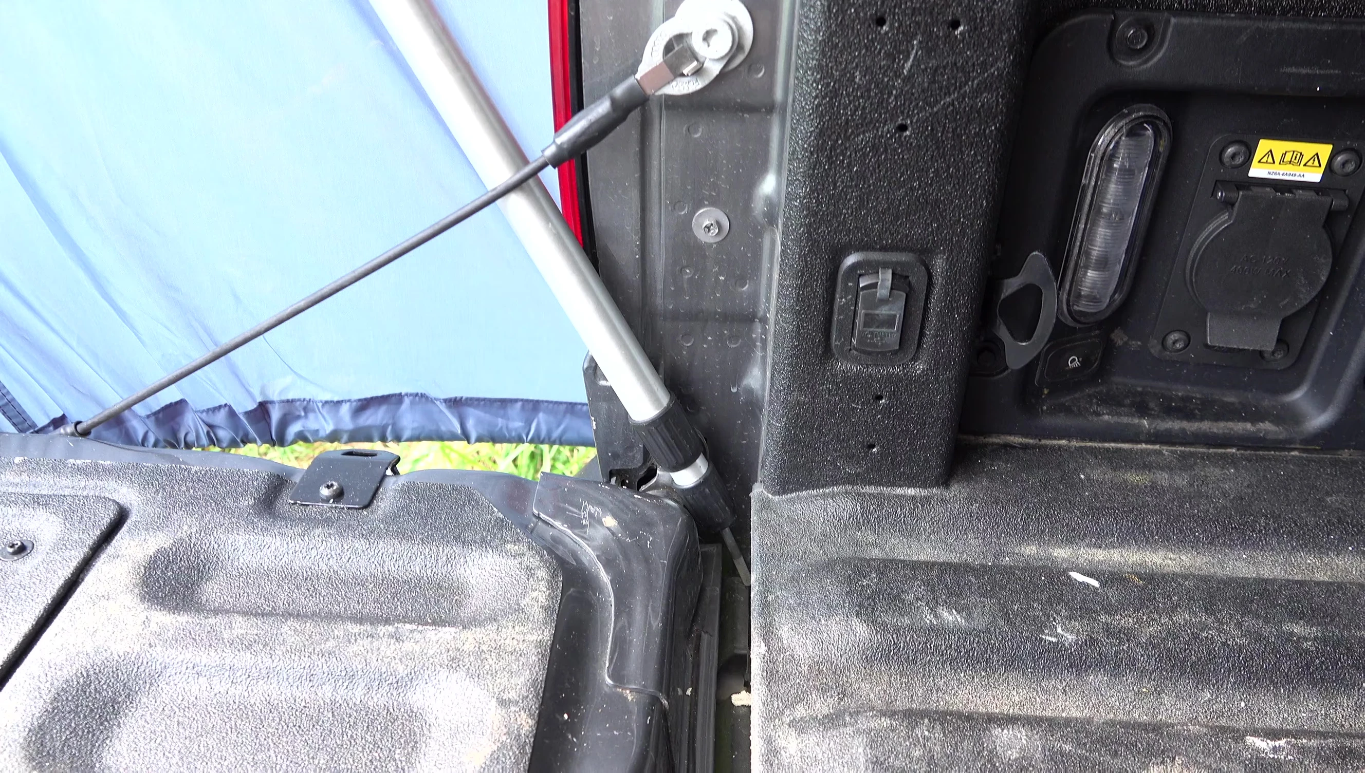 The user's interior setup of the DAC tent, including trekking poles.