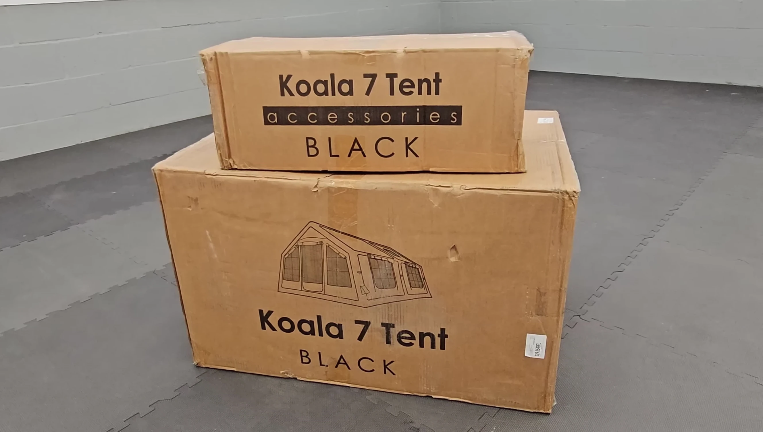 Two boxes containing the Cooe Koala 7 tent and accessories.