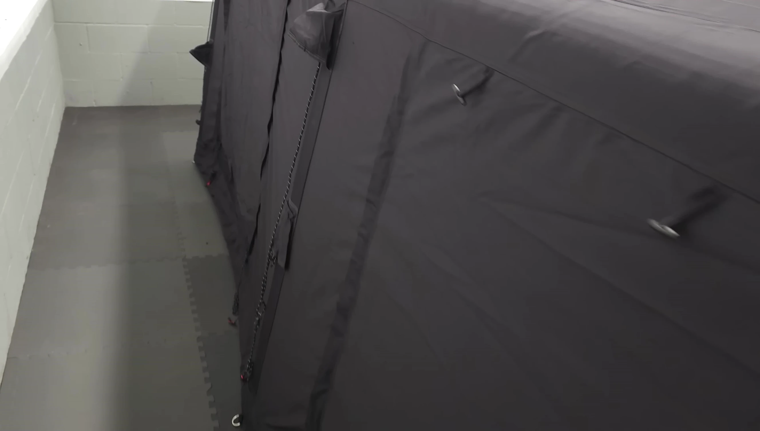 The side of the tent showing the windows, D-rings, and toggles.