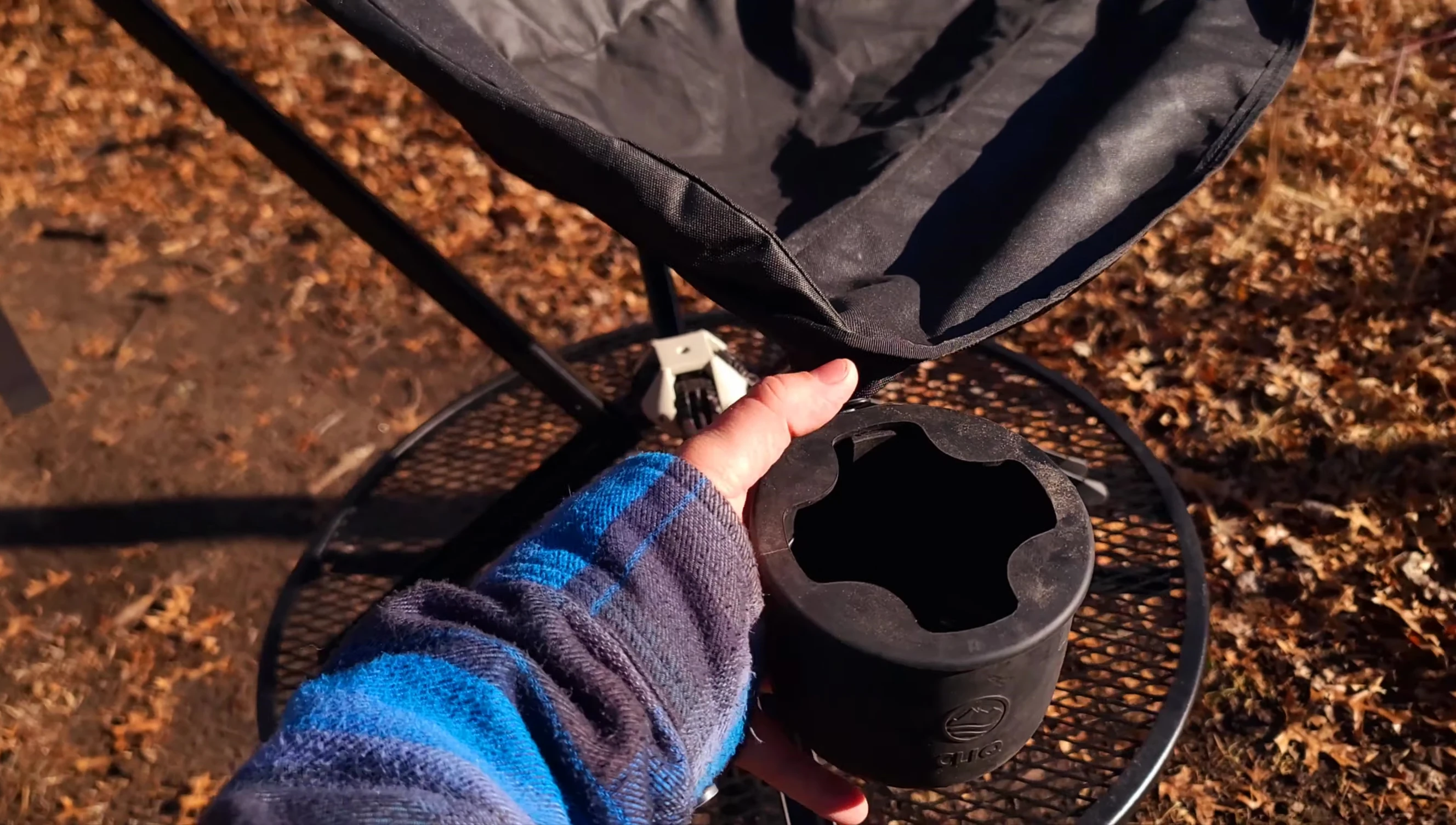 The detachable cup holder, showing its attachment mechanism.