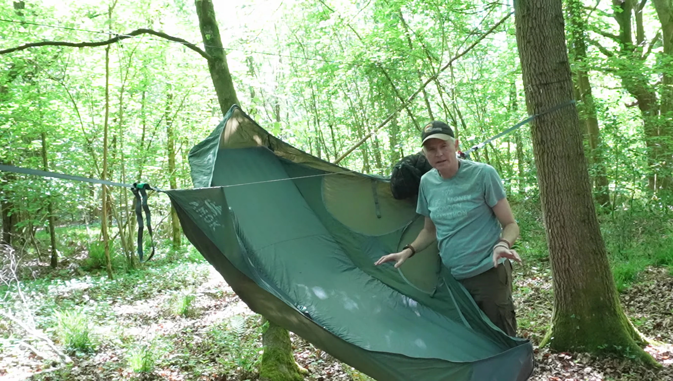 The reviewer attempts to level the hammock.