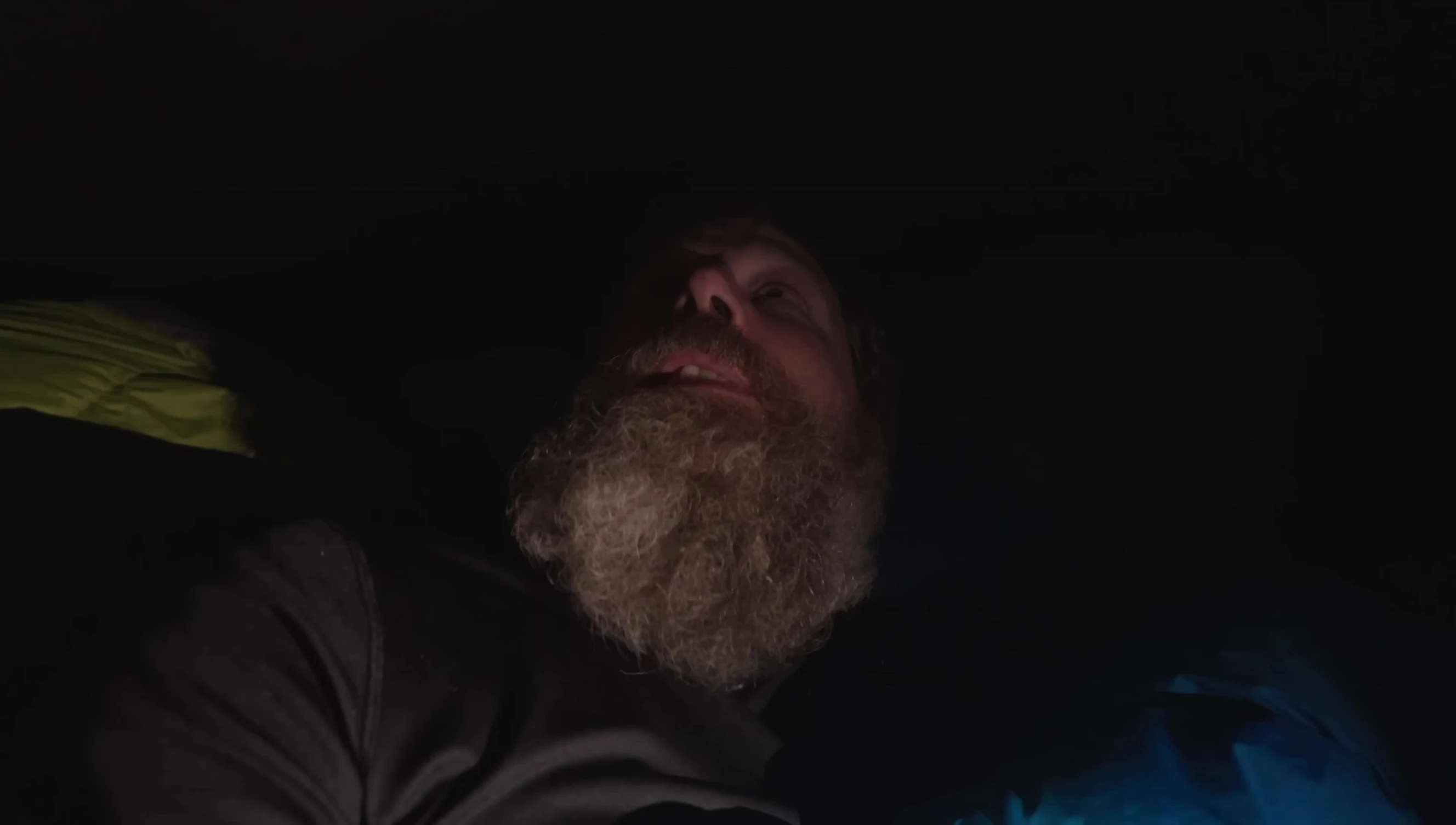 Narrator feeling chilled after exiting the wet sleeping bag.