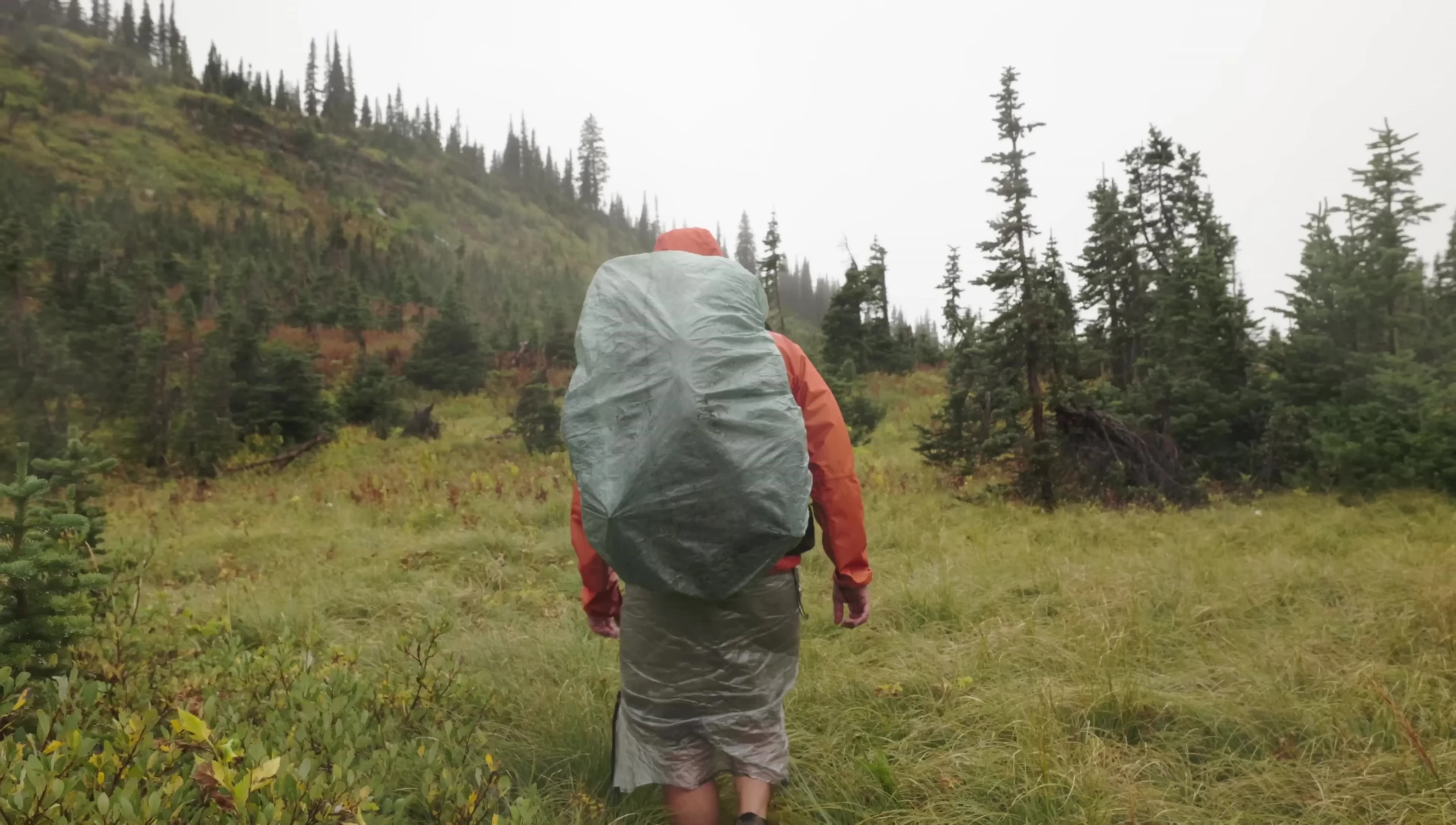 Narrator explaining real-world scenarios where a down sleeping bag might get wet.