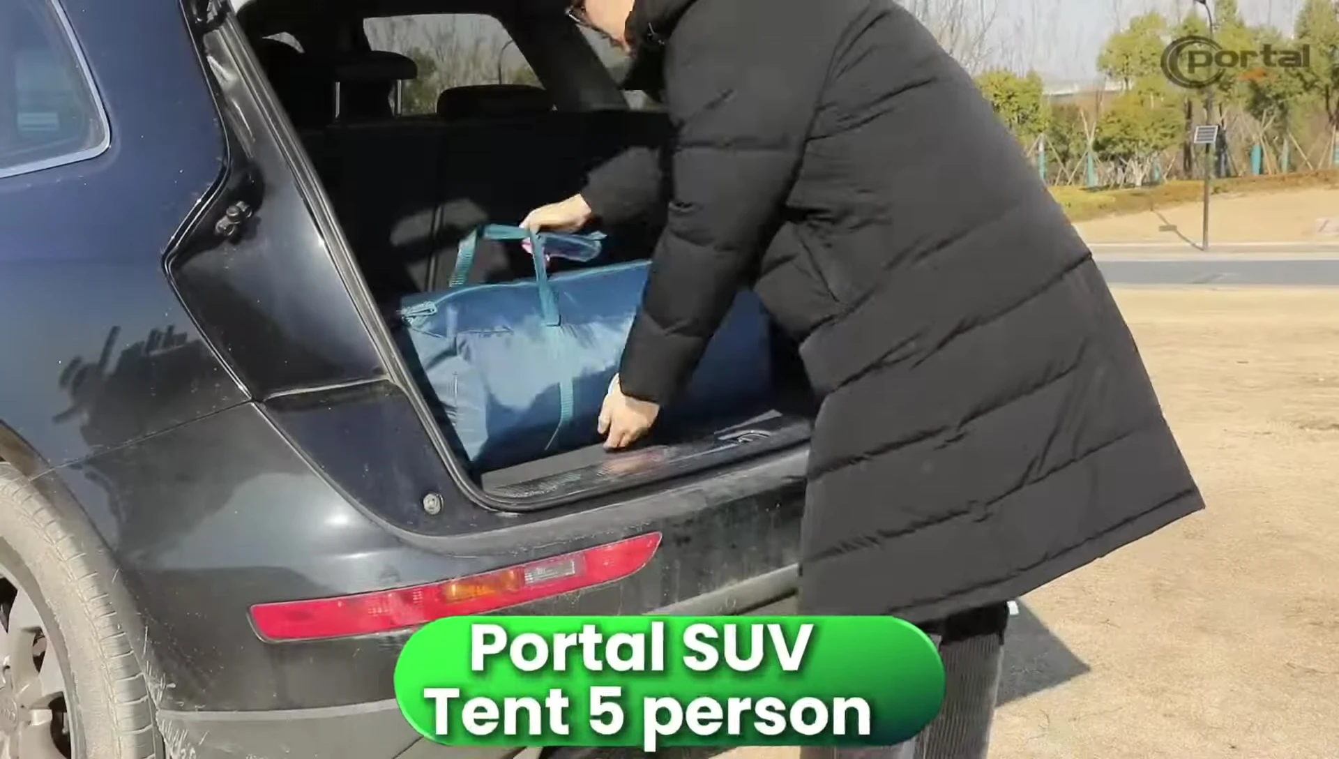 The Portal SUV tent shown partially set up.
