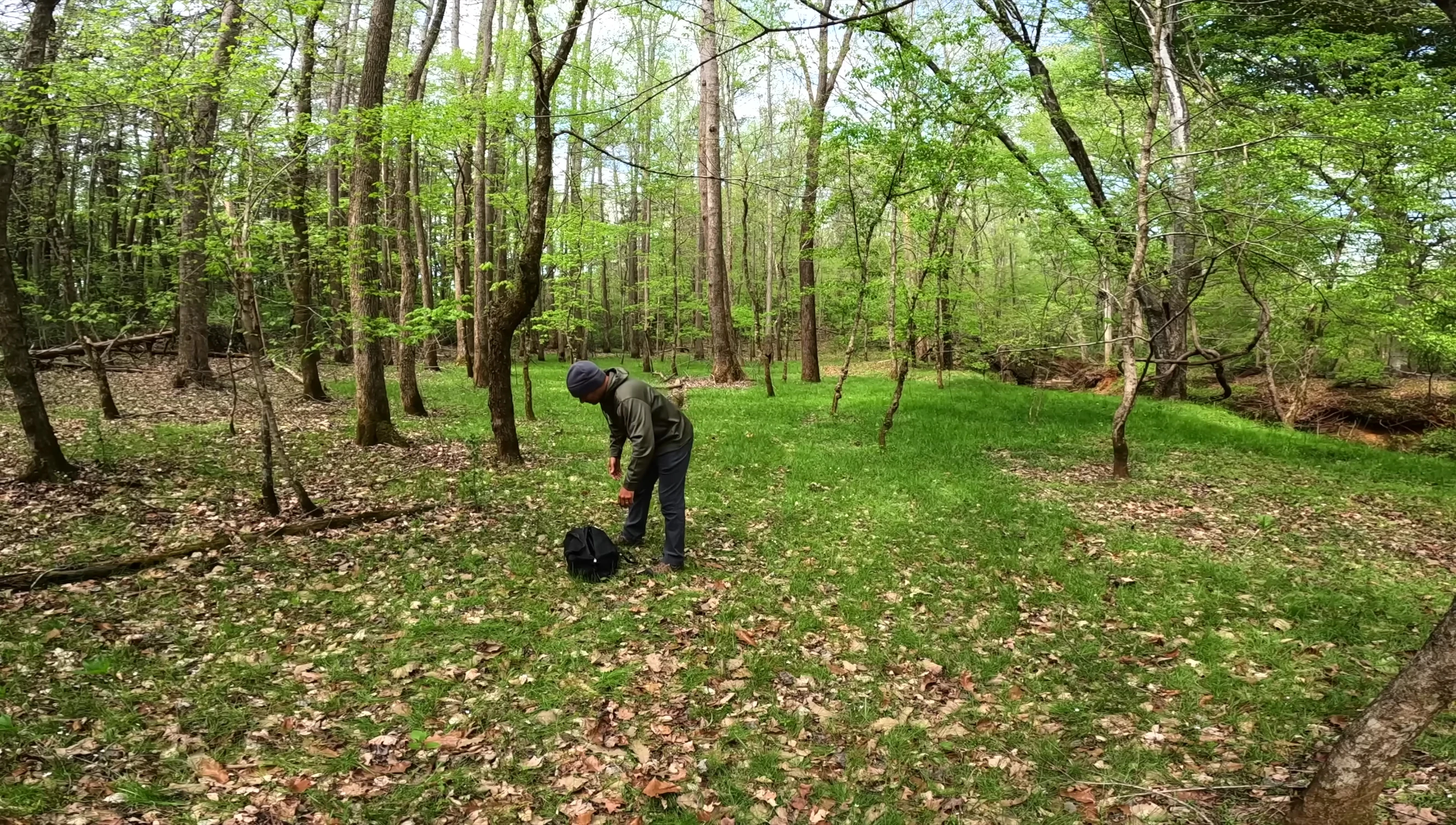 Person assembling the stand showing the poles connecting to the hubs.