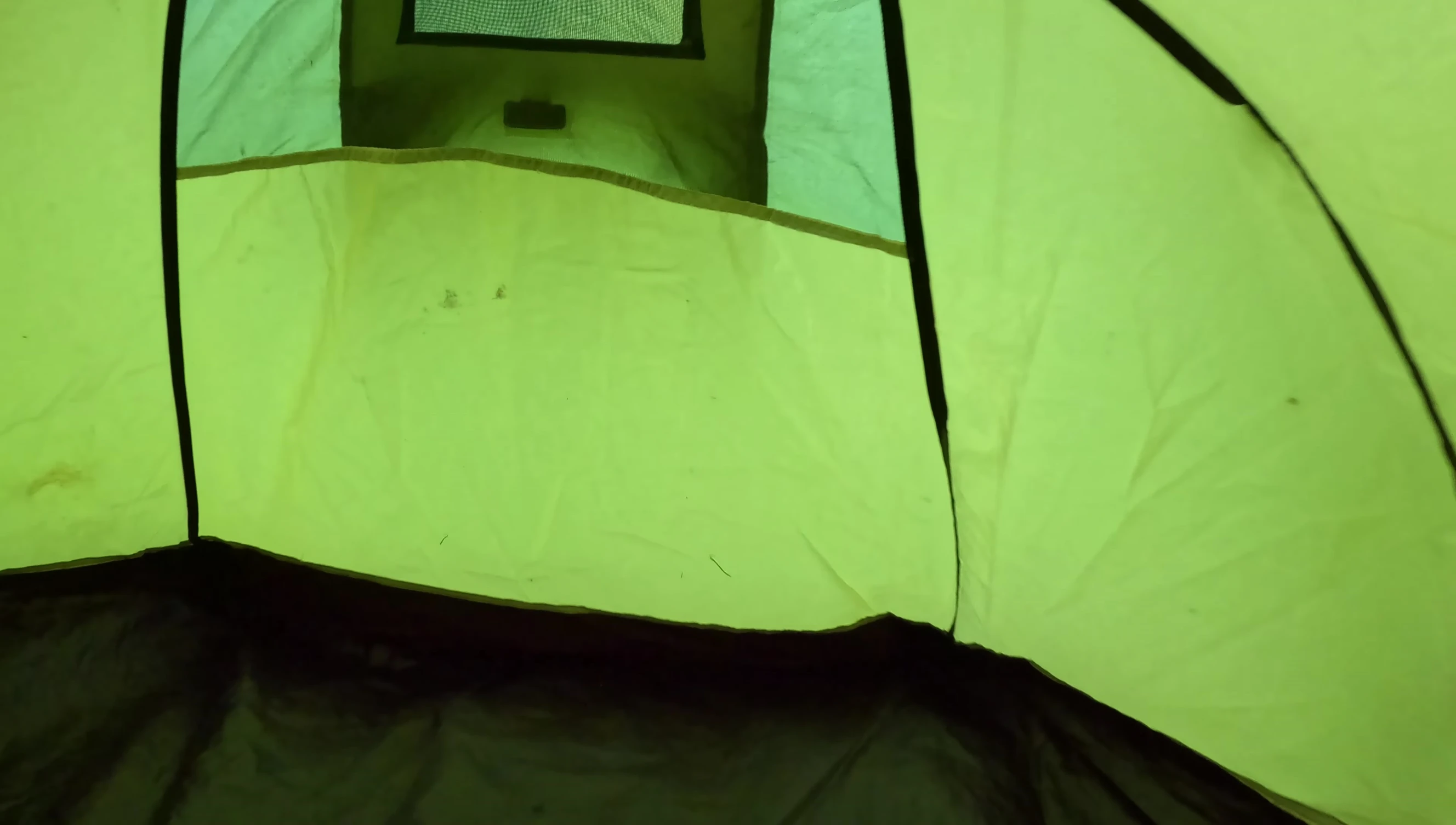 Interior view showing the storage pockets and clothesline.