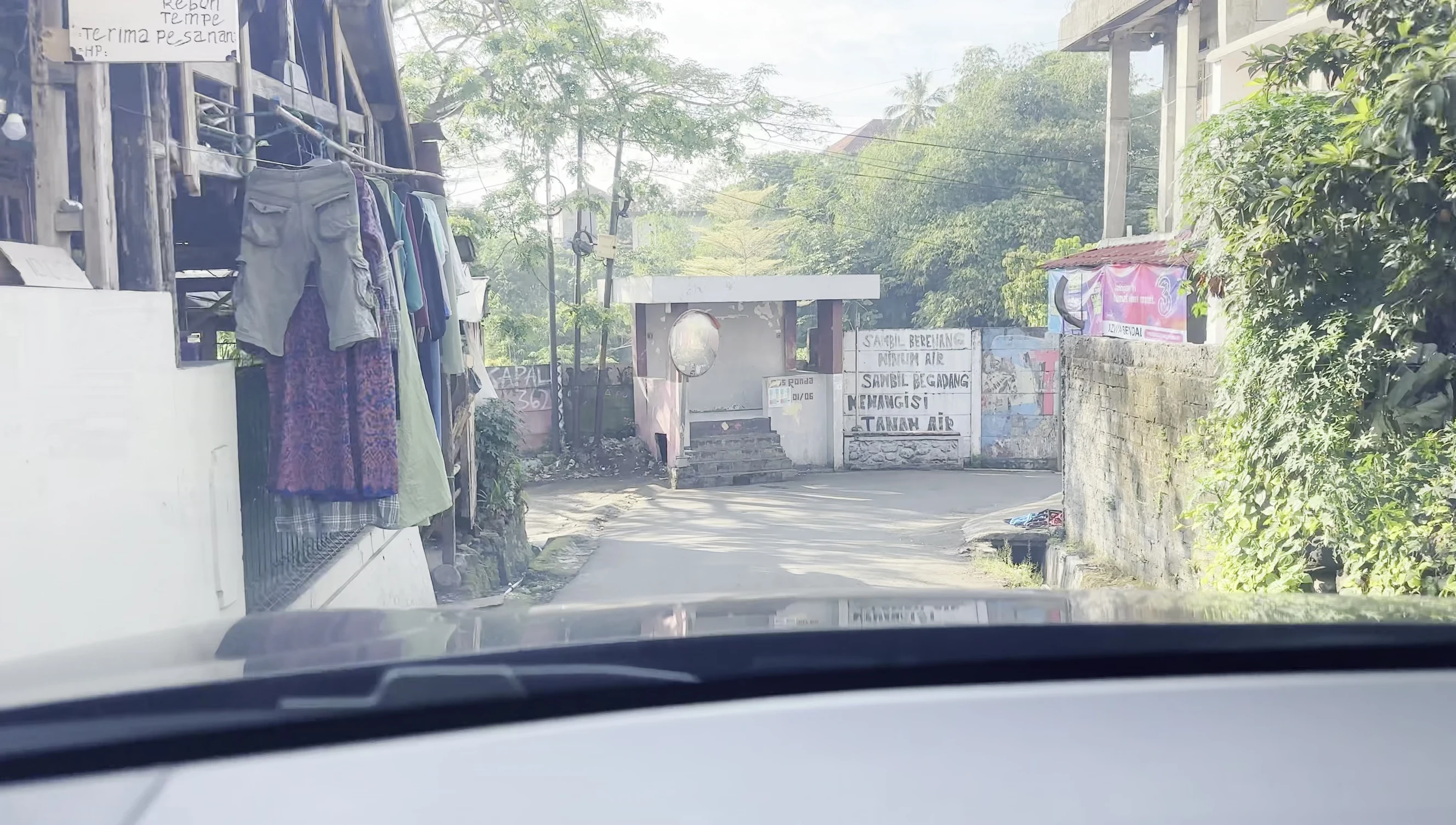 A shot of the narrow and winding road leading to Tajur Halang Village