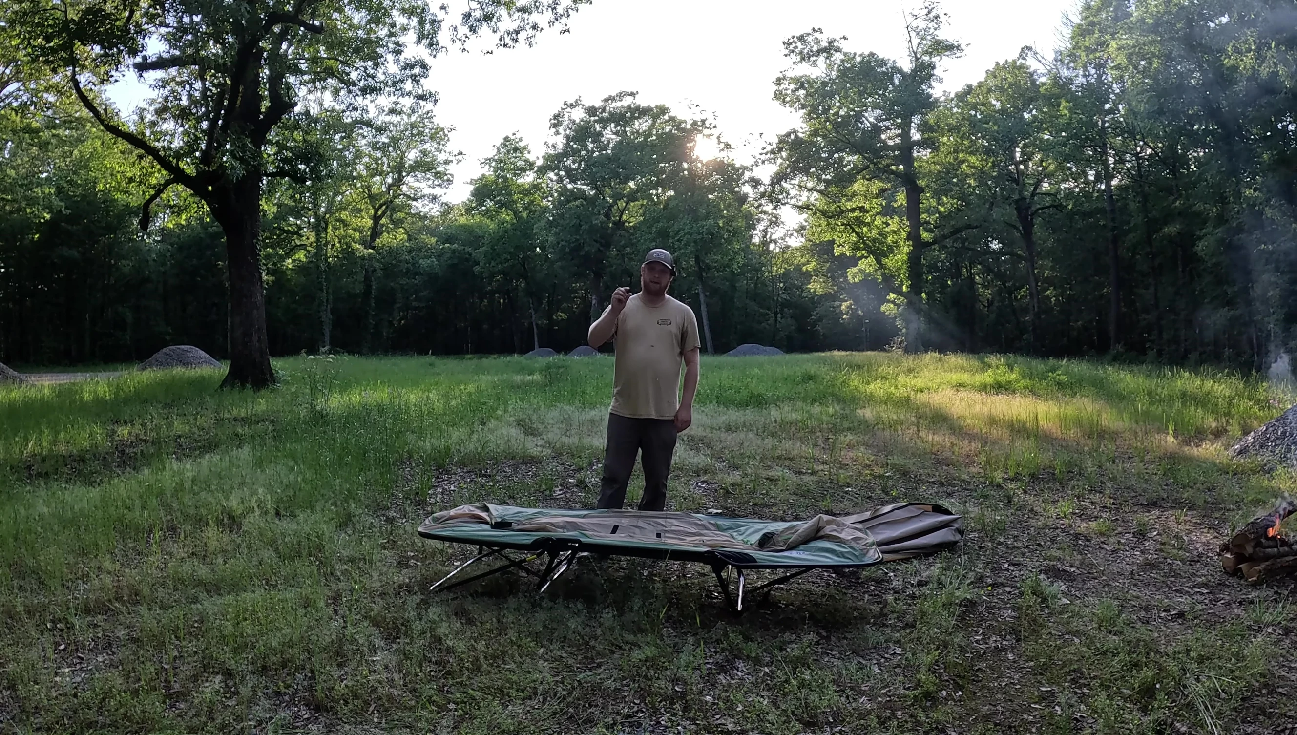 Showing the foam pad being placed on the cot to improve comfort.