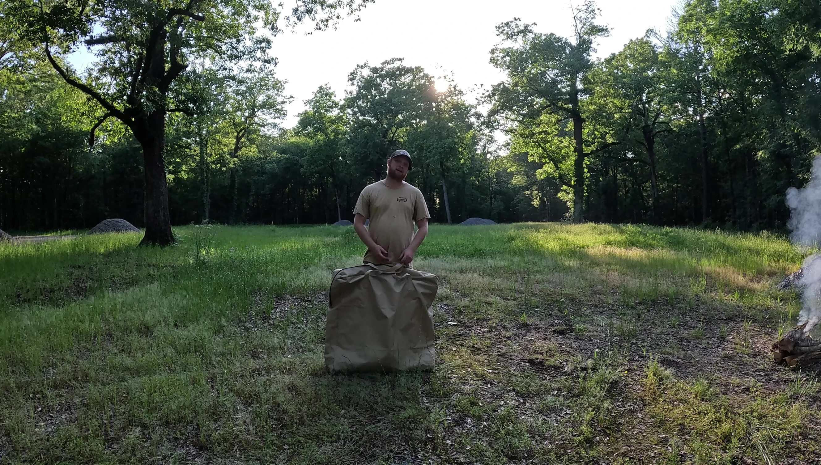 The cot next to the car, emphasizing car camping convenience.