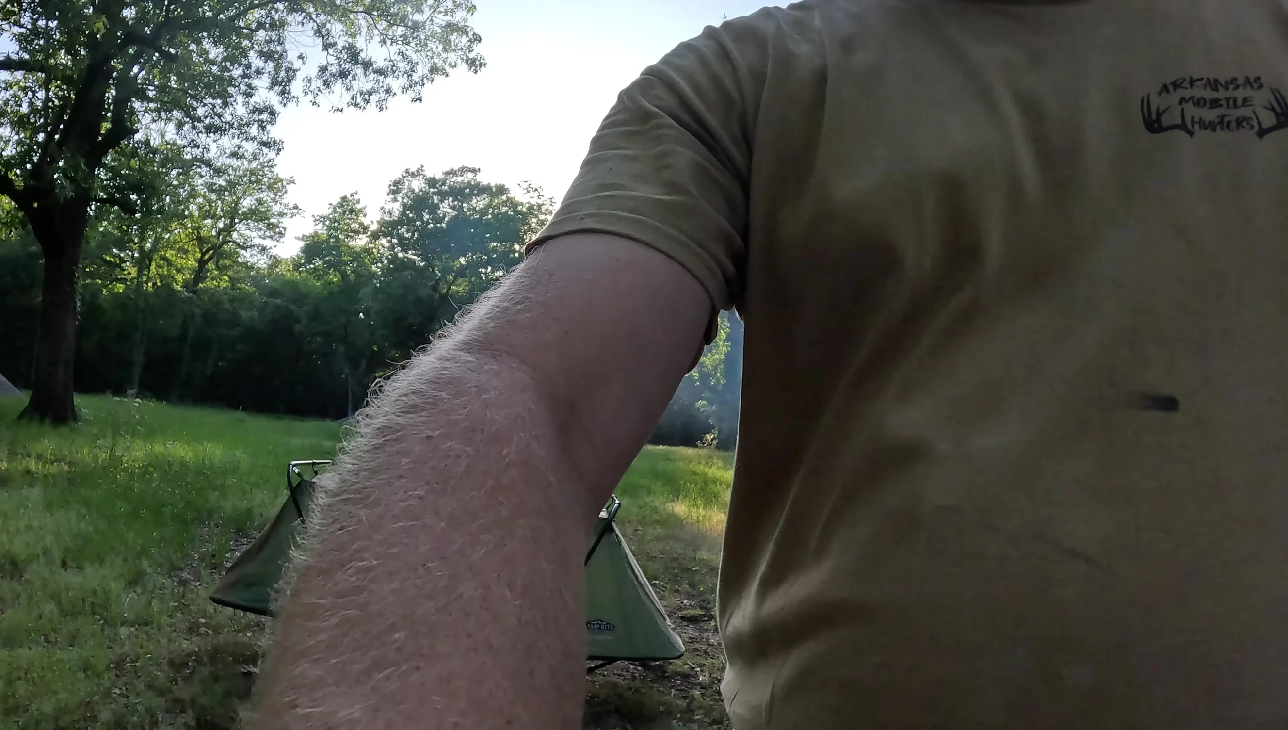 Person inside the cot, demonstrating interior space.