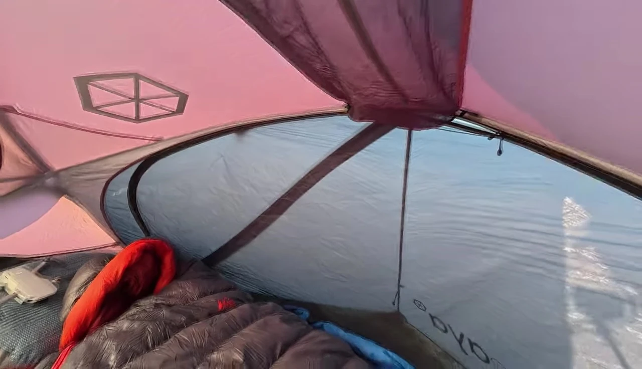 Demonstration of space usage with a large mat inside the tent.