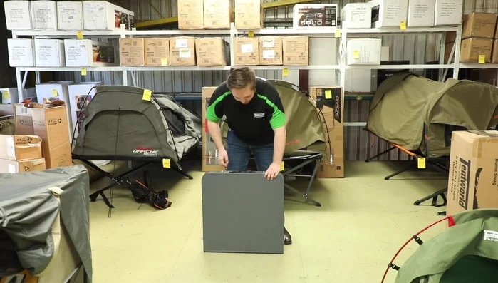 Remove the legs from their storage compartments.