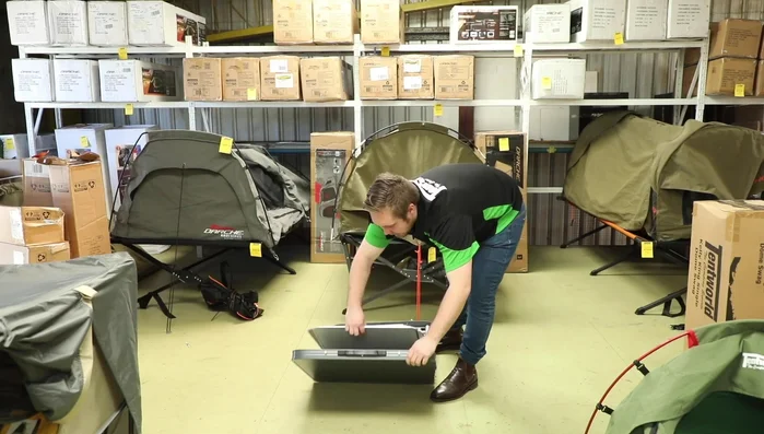 Remove the legs from their storage compartments.