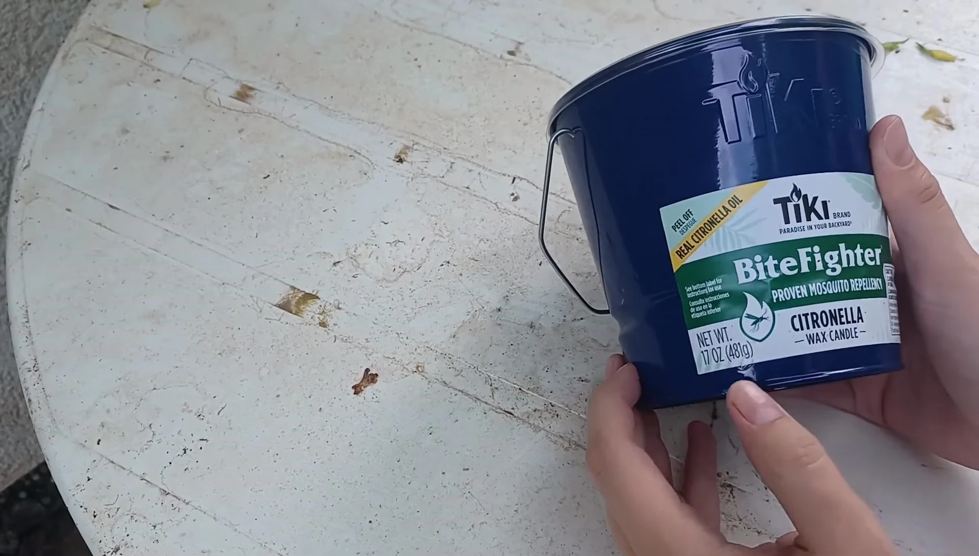 Shot showing the candle's size and weight information