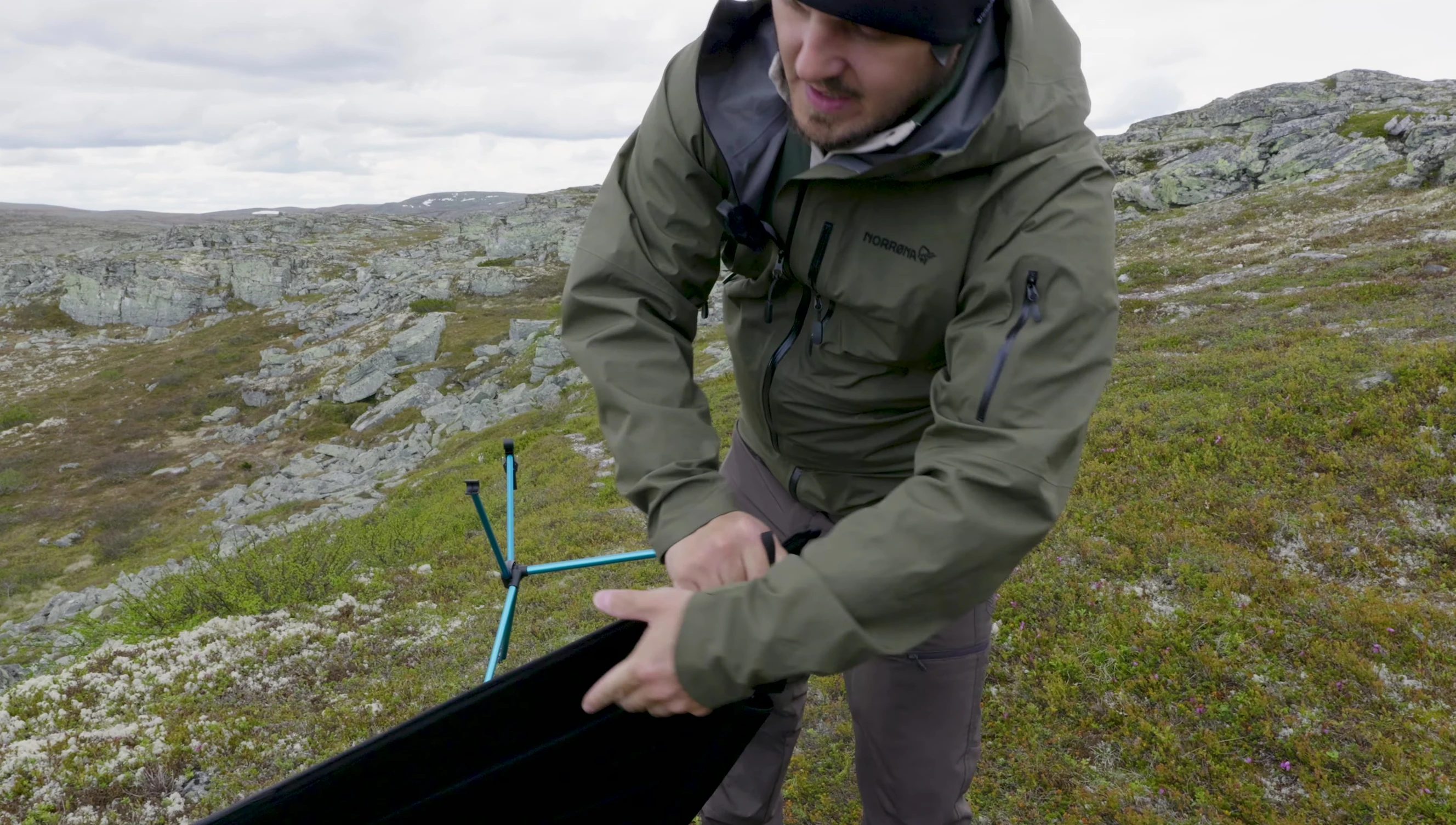Flipping the table and positioning the support poles.