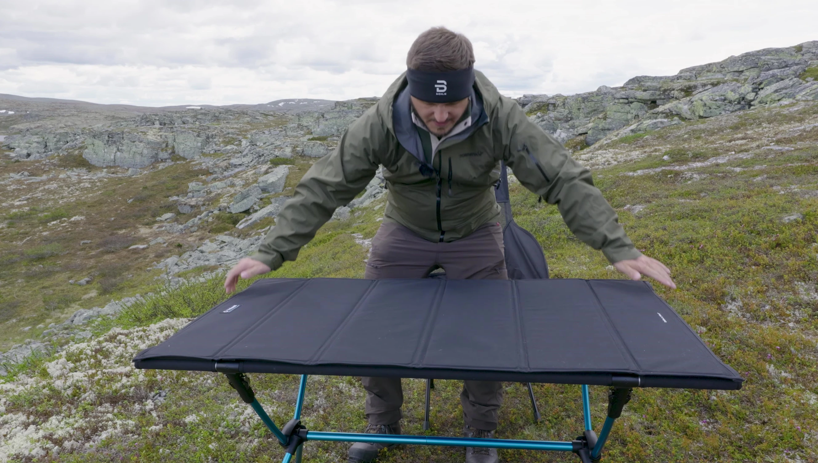 Demonstrating the table's height with a person seated.