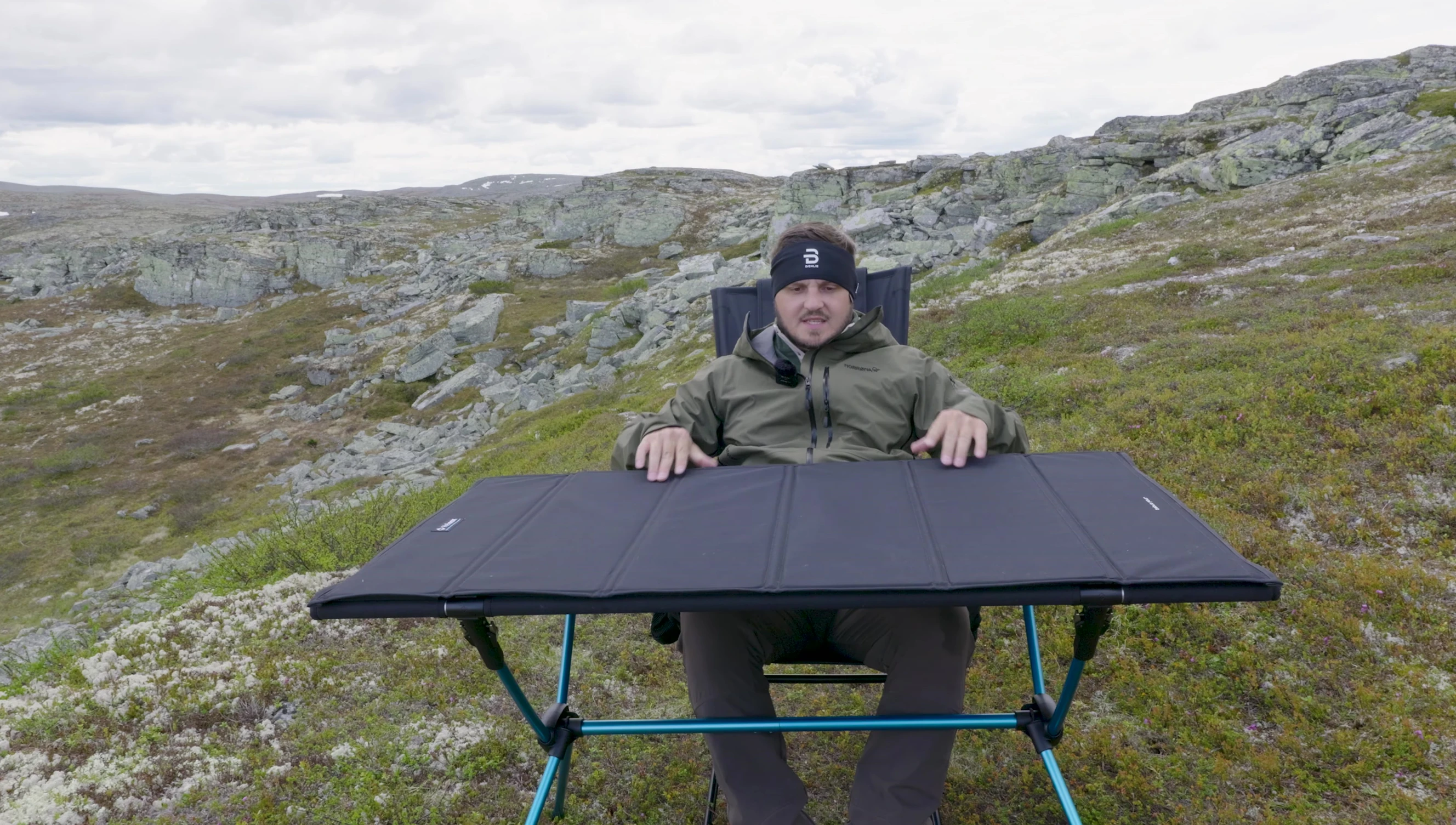 A person sitting at the table to demonstrate its size and usability.