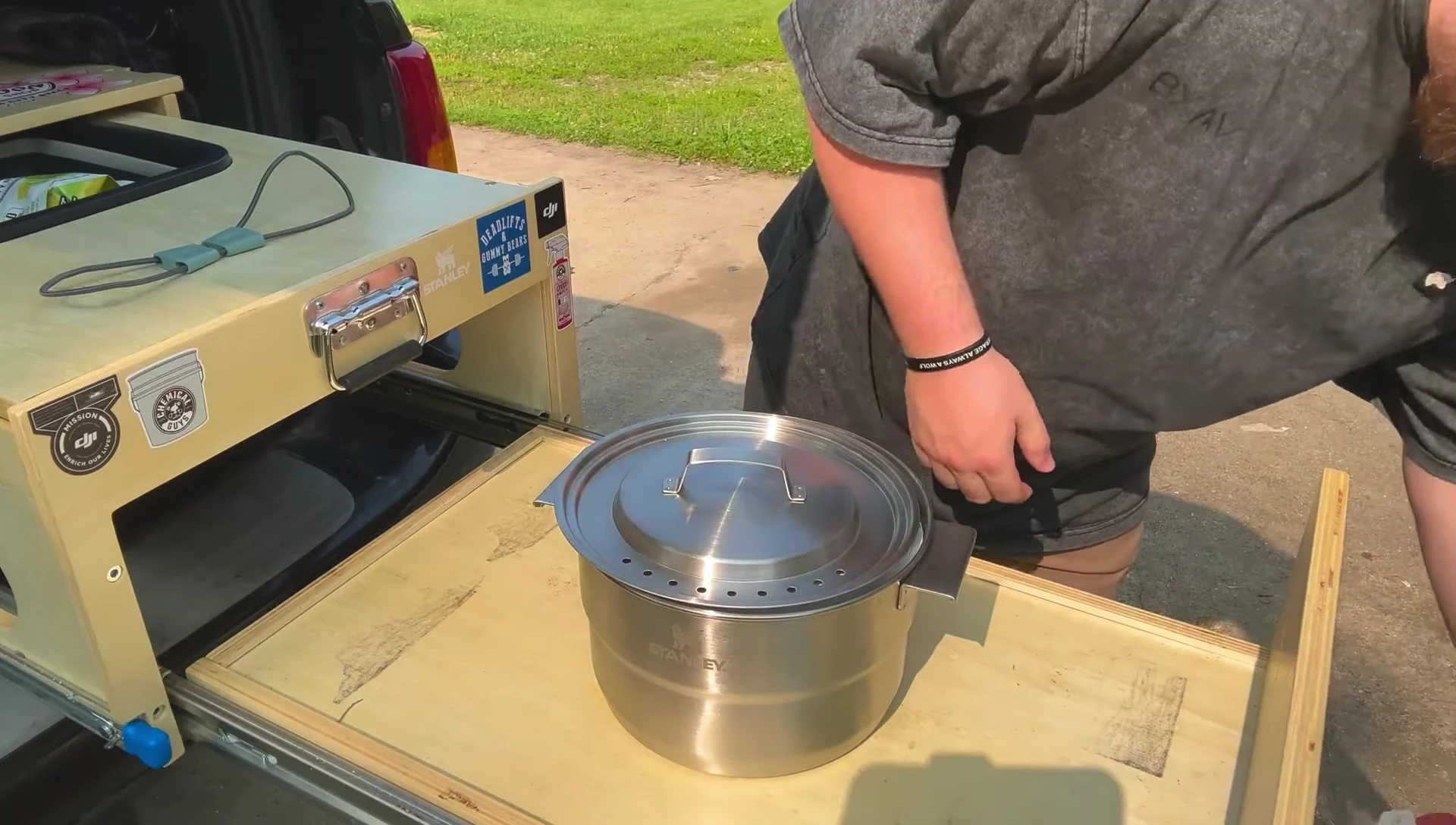 The cookset lid shown; highlighting the printed stacking instructions.