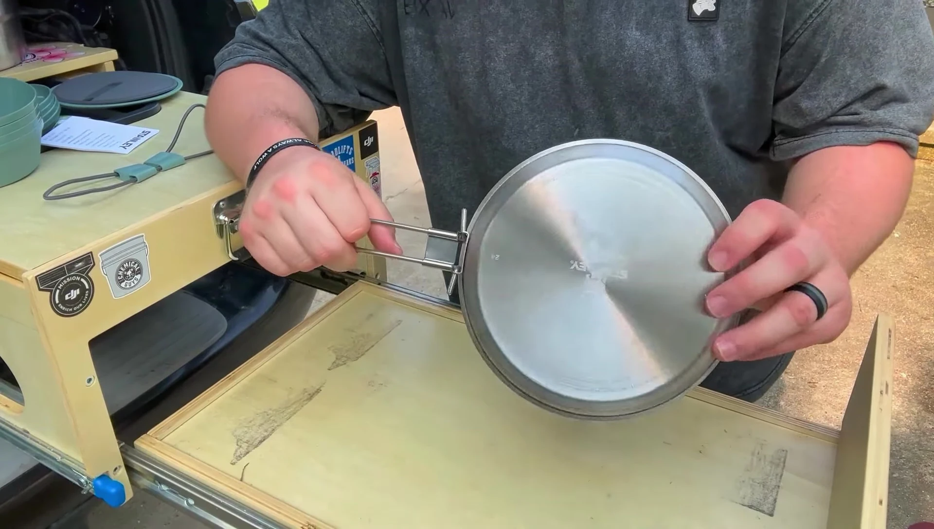 The pan handle shown folded away.