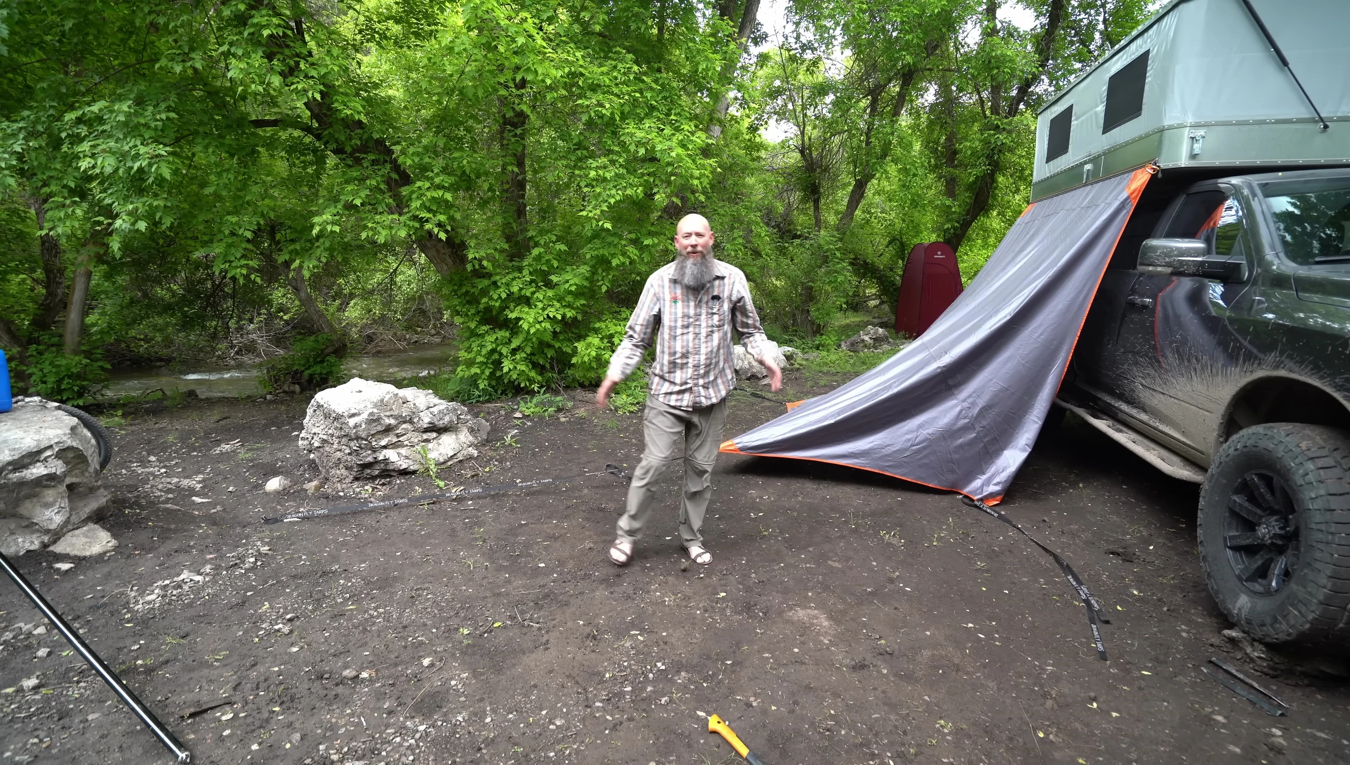 Demonstrating the adjustable length of the poles.