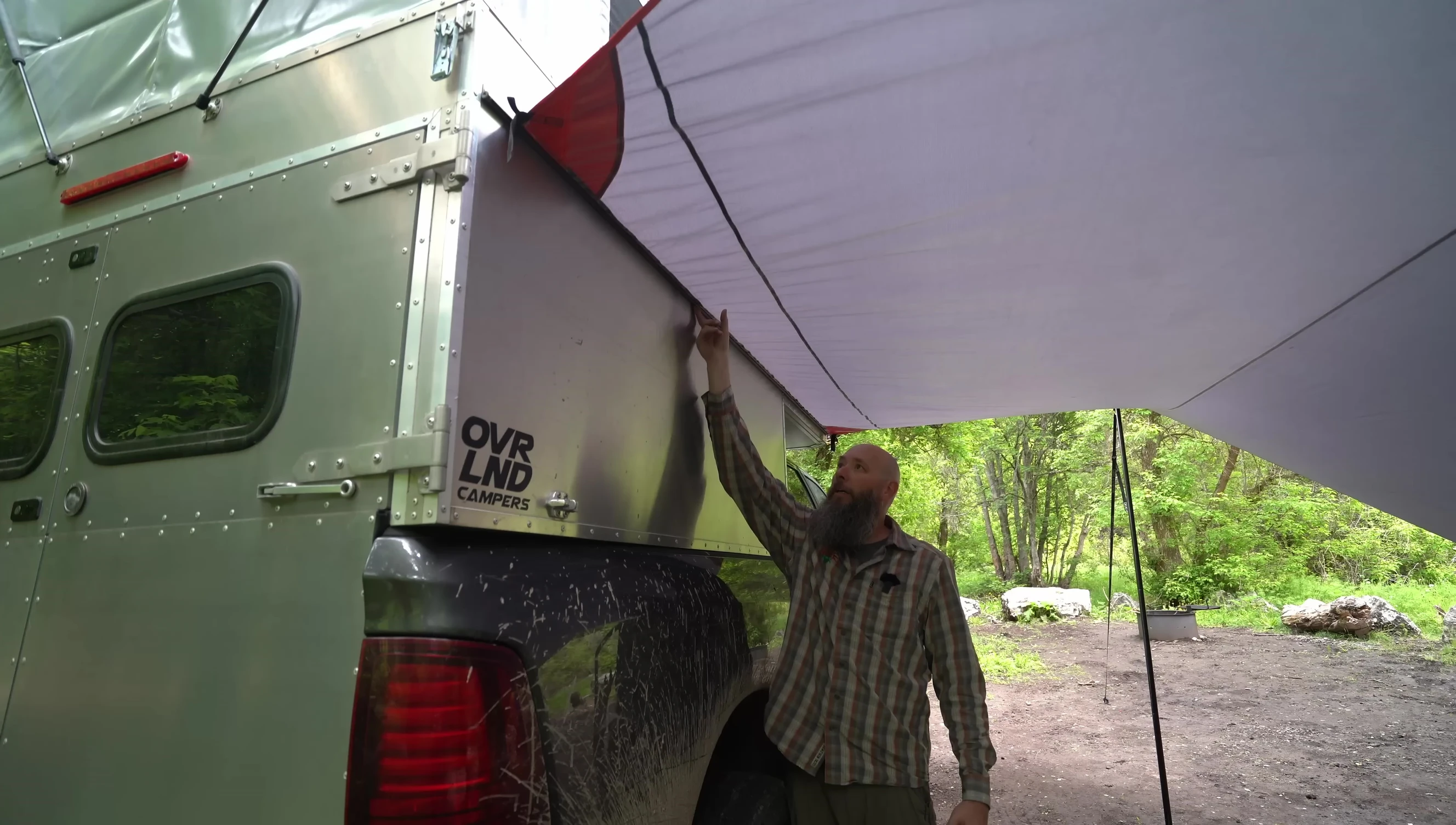 Comparison shot highlighting the gap in traditional awnings versus the seamless fit of the Dragonfly Tarp.