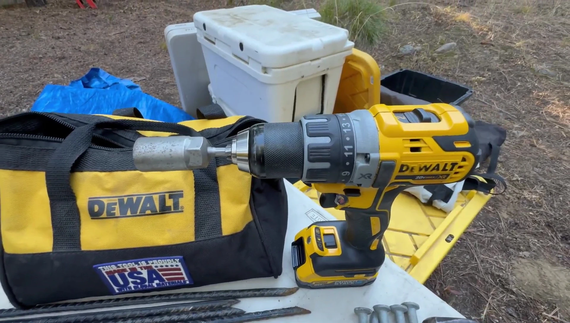 Drill with socket attachment for lag bolts.