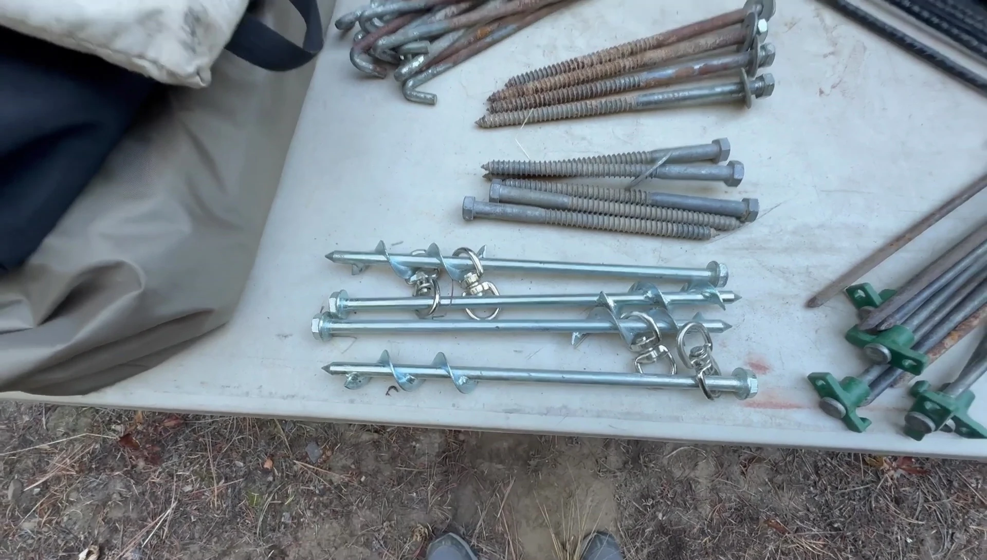 Close-up of long screw stakes.