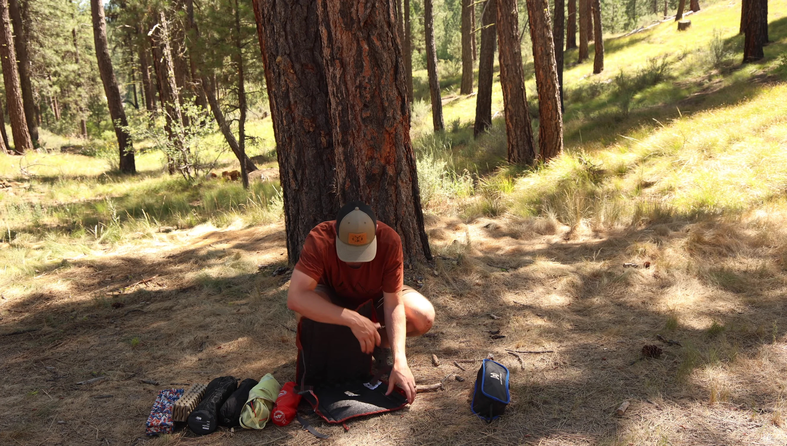 The reviewer demonstrating the reclining function of the Crazy Creek Hex 2.0.